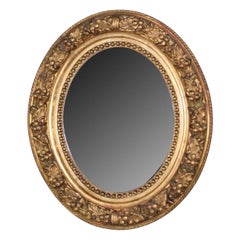 Antique French Petite Giltwood Oval Mirror with Relief Carved Grape Vine Foliage