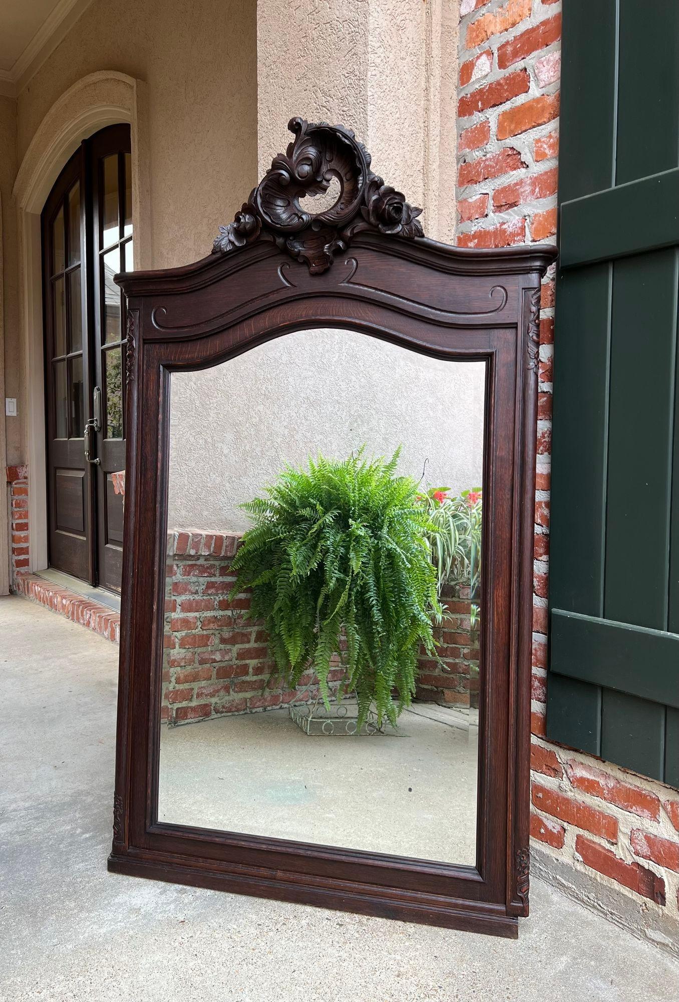 Antique French pier console wall mirror Louis XV carved oak 19th century.

Direct from France, another fabulous hand carved mirror, one of a large group in our most recent container.
A tall and graceful silhouette defines this gorgeous pier