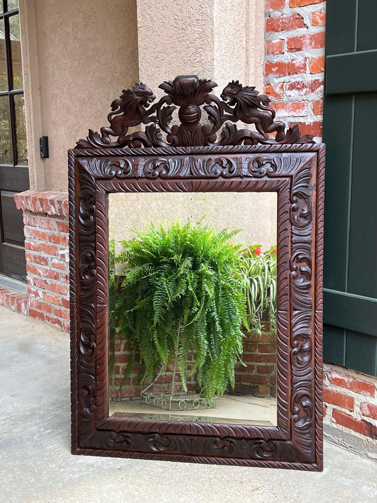 Antique French Pier wall mirror renaissance black forest lion crest carved oak.

Direct from France, another fabulous hand carved frame mirror, one of a large group in our most recent container The original large crown sets the tone and features