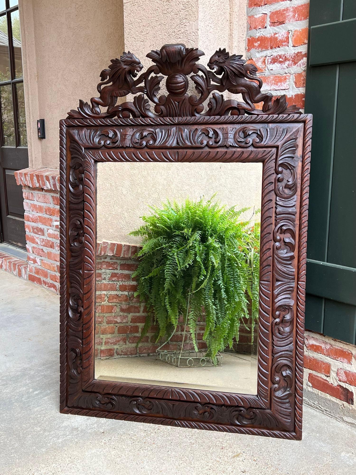 French Provincial Antique French Pier Wall Mirror Renaissance Black Forest Lion Crest Carved Oak For Sale