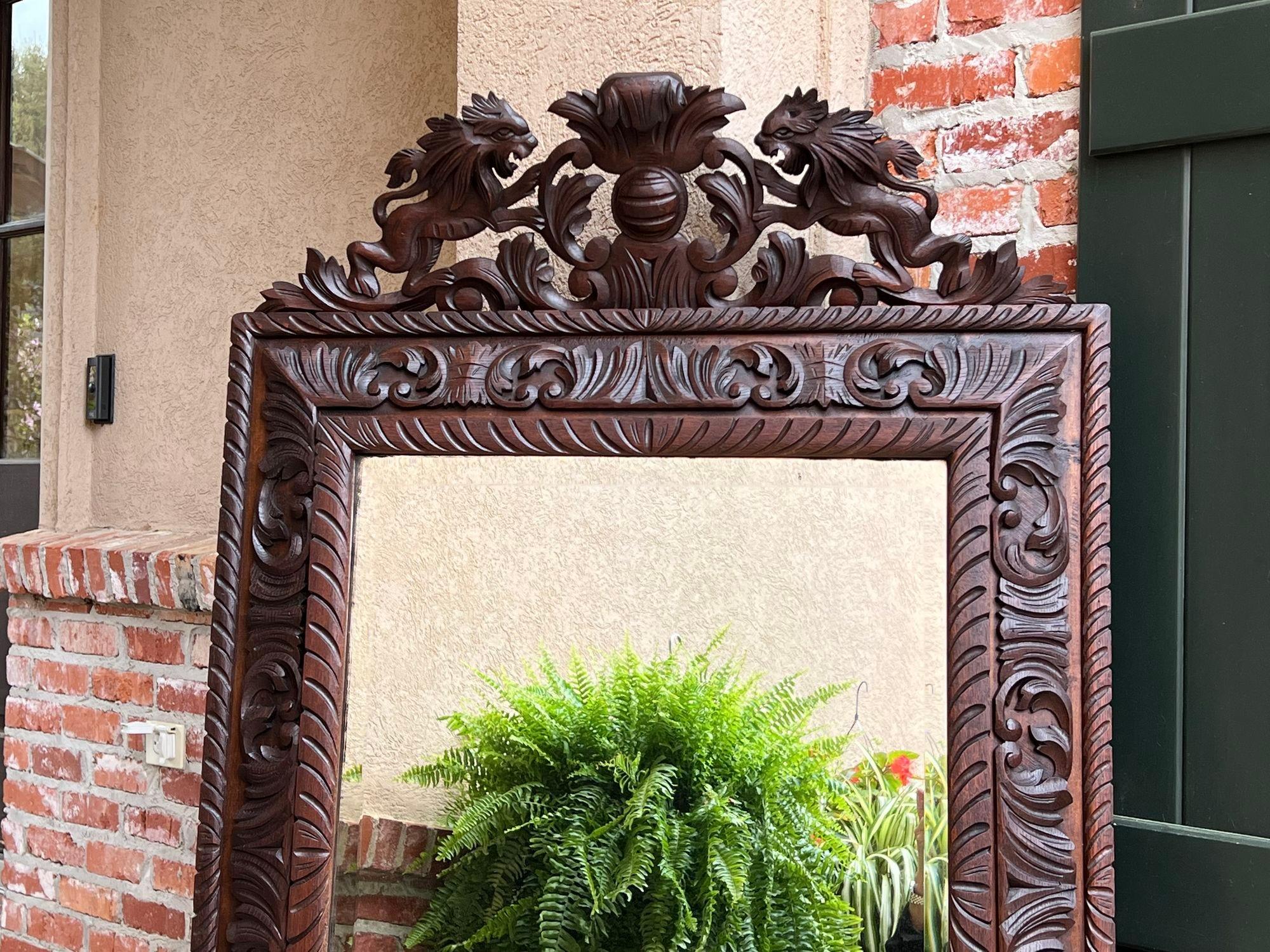 Hand-Carved Antique French Pier Wall Mirror Renaissance Black Forest Lion Crest Carved Oak For Sale