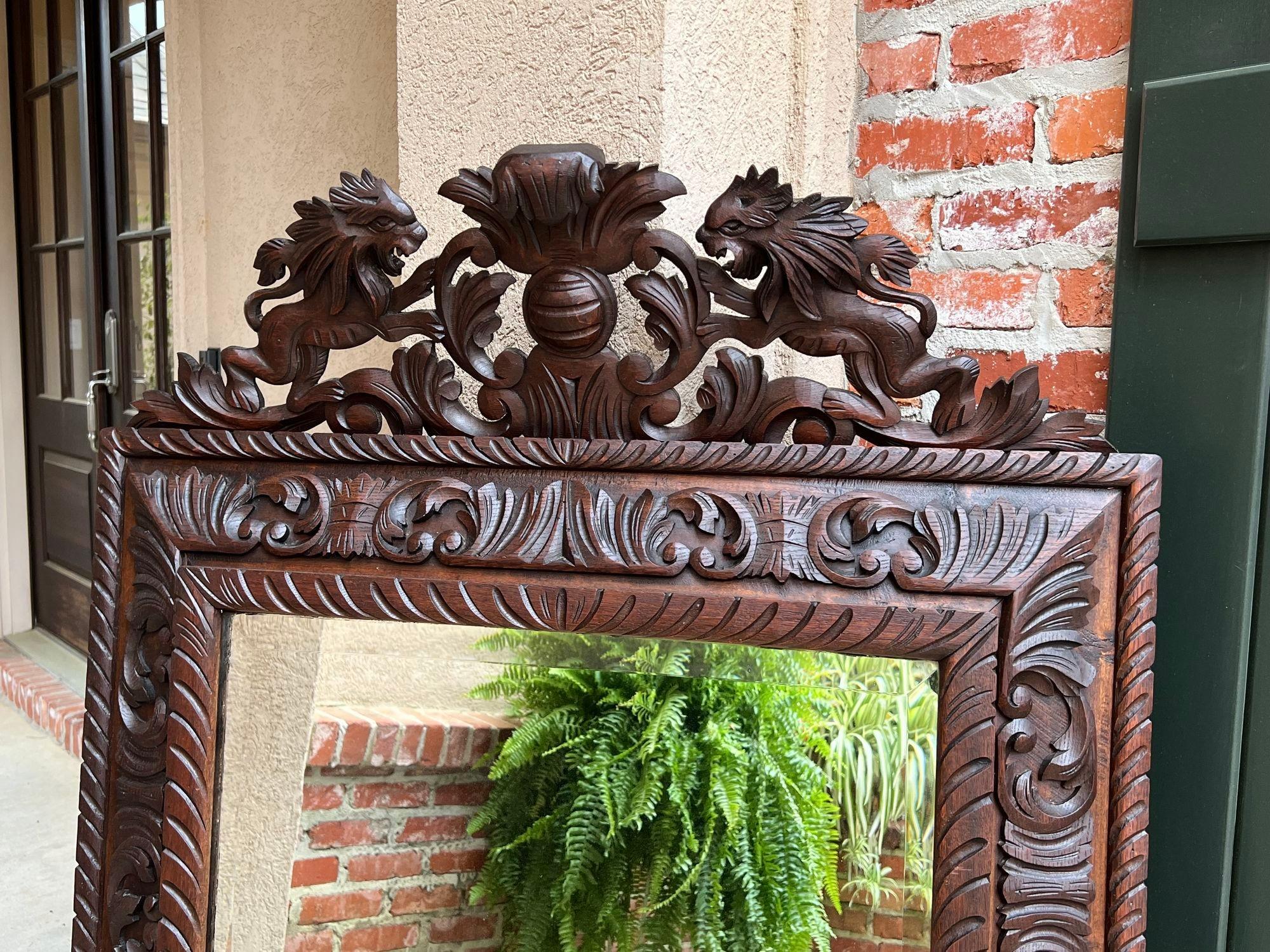 Antique French Pier Wall Mirror Renaissance Black Forest Lion Crest Carved Oak In Good Condition For Sale In Shreveport, LA