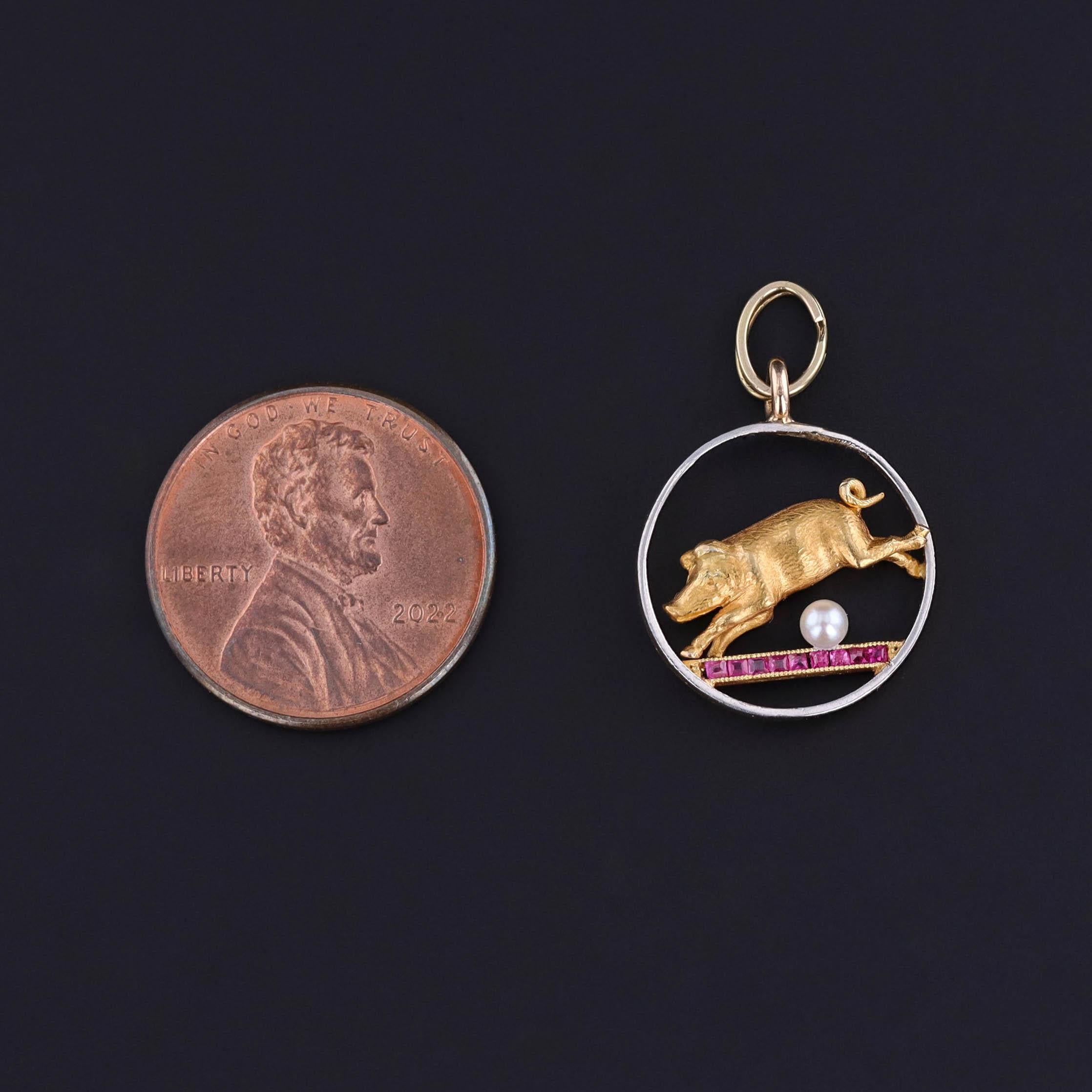 This enchanting antique French charm, dating to circa 1900, showcases a whimsical leaping pig—long associated with prosperity and good fortune—beautifully rendered in solid 18 karat gold with delicate platinum accents. The pig's eyes are set with