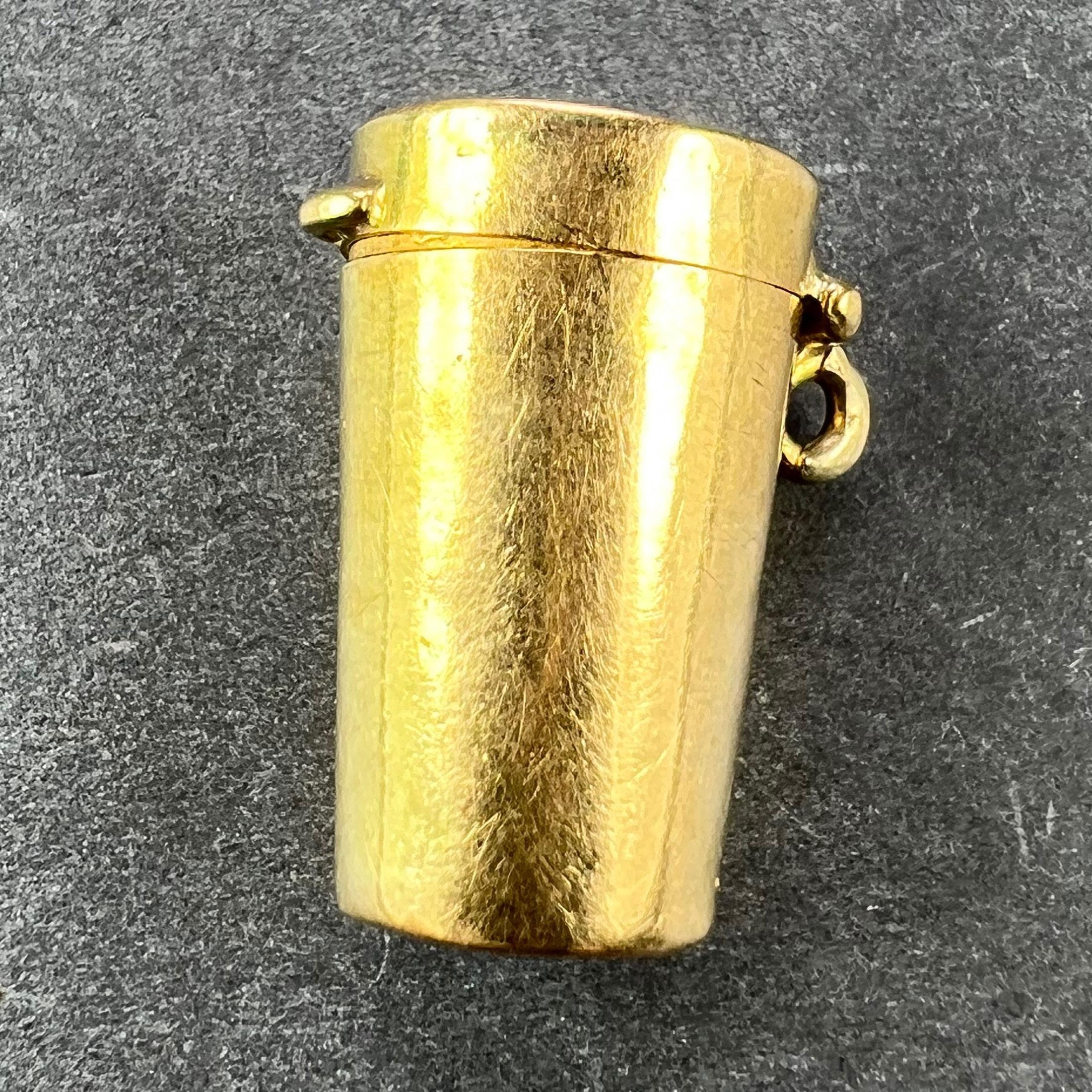 An antique French 18 karat (18K) yellow gold charm pendant designed as a miniature cylindrical etui or pill box. Stamped with two eagle's head for 18 karat gold and French manufacture along with a partial unidentified maker's mark.

Dimensions: 2 x