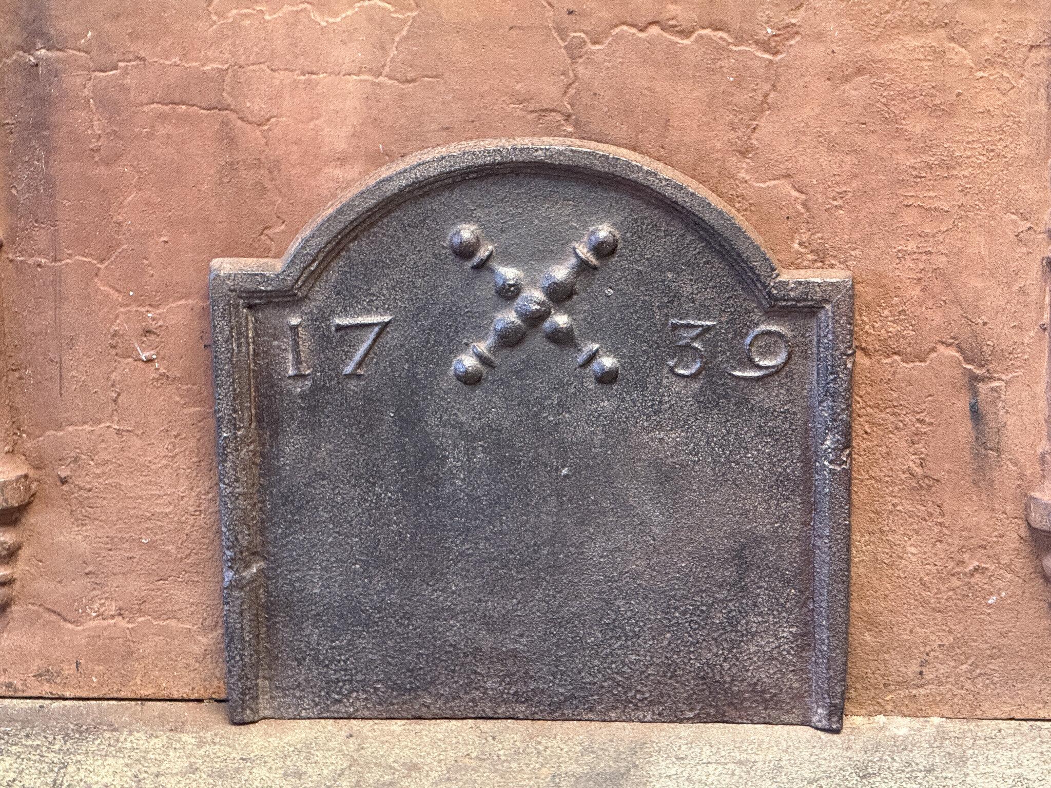 18th century French fireback with a Saint Andrew's cross and two pillars of Hercules. Saint Andrew is said to have been martyred on a cross in this shape. The cross is since then a sign for humility and sacrifice. The pillars of Hercules symbolize