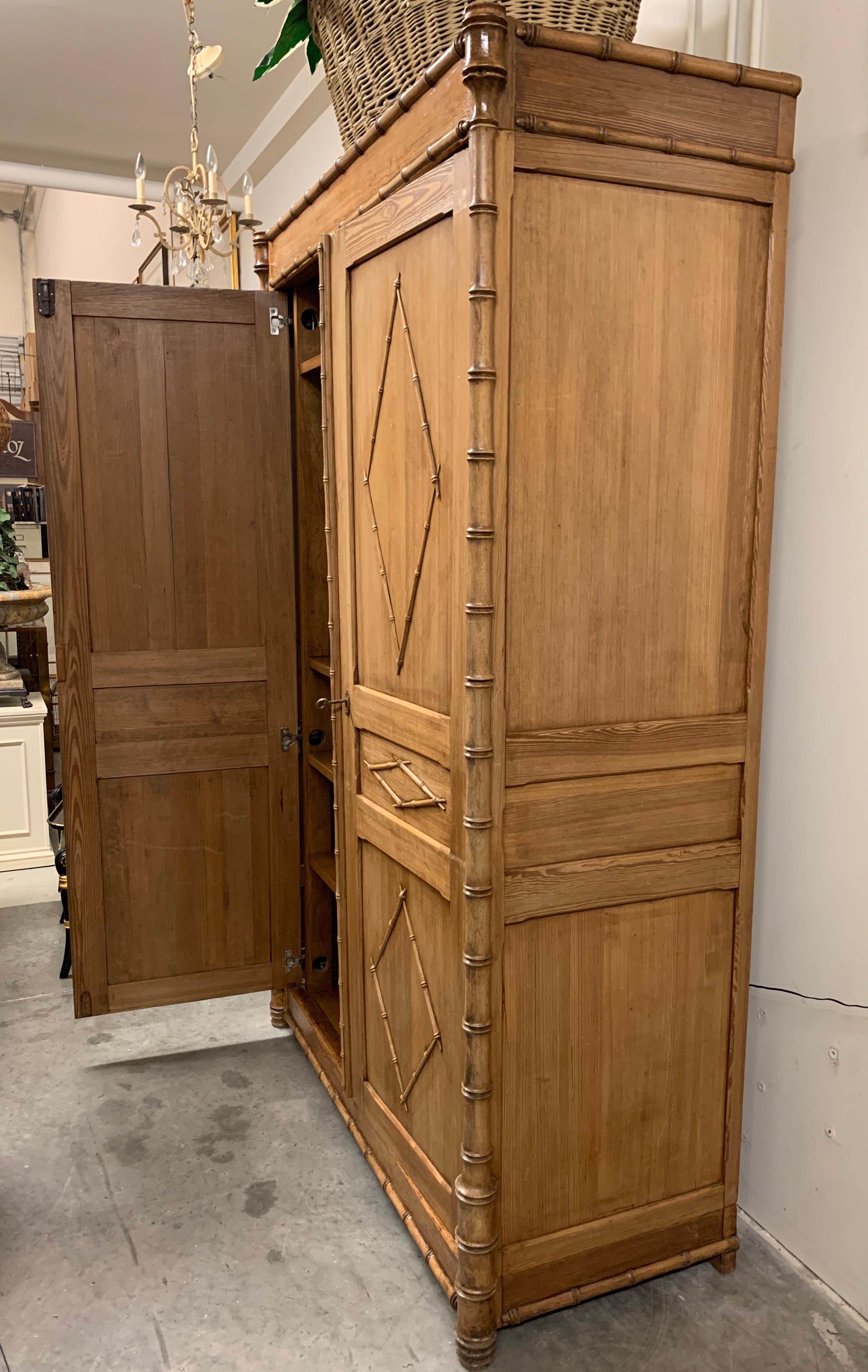 Hand-Crafted Antique French Pine Two-Door Armoire with Faux Bamboo Carved Motif