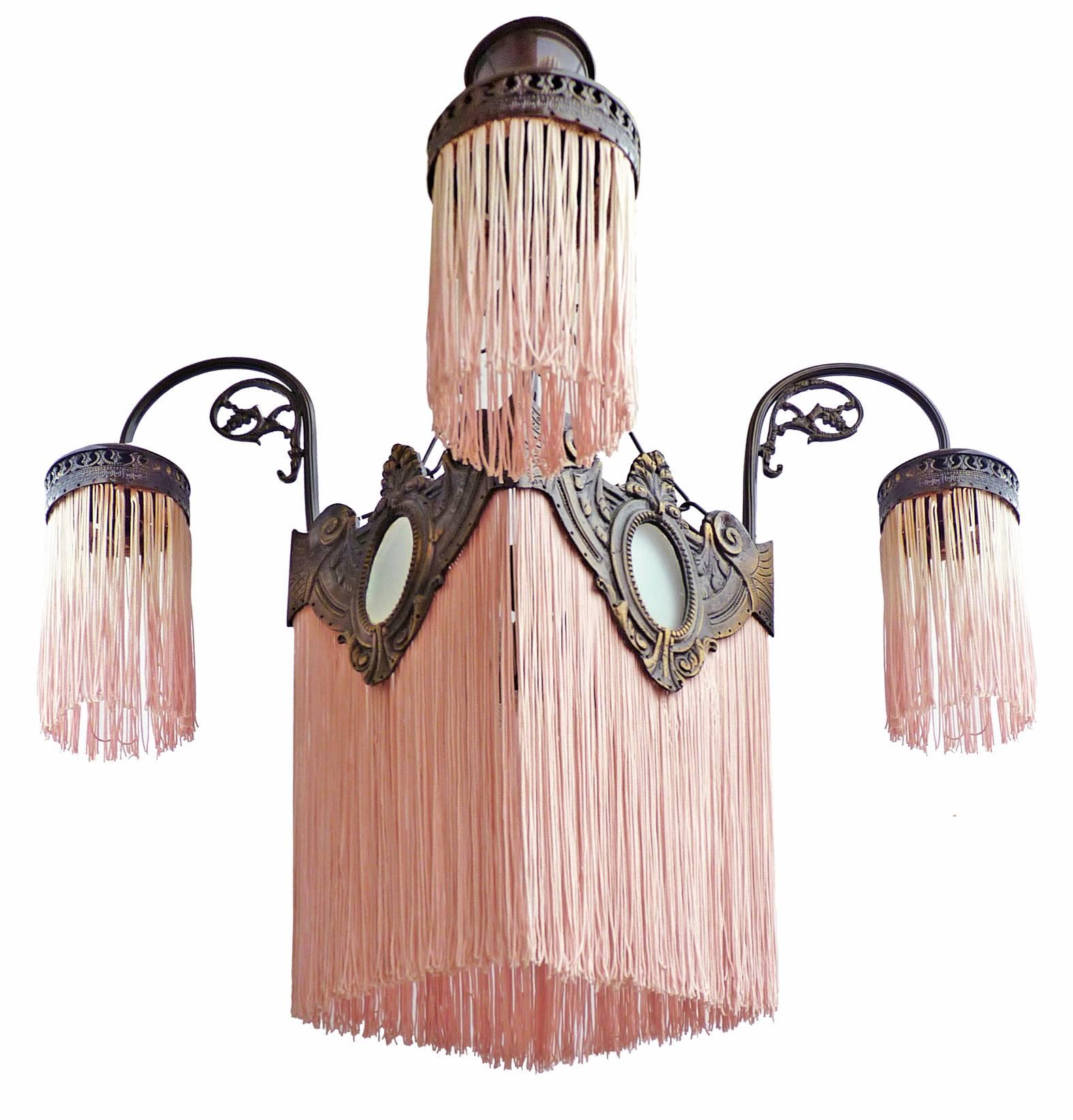 Antique French pink fringes and bronze Art Nouveau/Art Deco chandelier
Measures:
Diameter 20 in/ 50 cm
Diagonal; 26 in/ 66 cm
Height 32 in/ 80 cm
Weight 4.5 Kg / 5 lb
Five-light bulbs E14 / good working condition/European wiring.
Your item