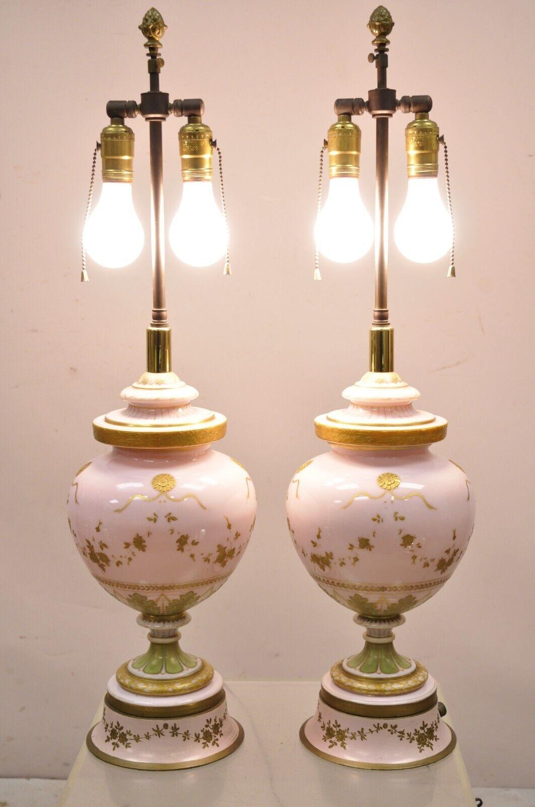 Antique French Pink Porcelain Hand Painted Bulbous Table Lamps - a Pair. Item features french pink porcelain bulbous forms, gold gilt painted details, hand painted wooden base, twin brass sockets, very nice antique pair, quality craftsmanship. Circa
