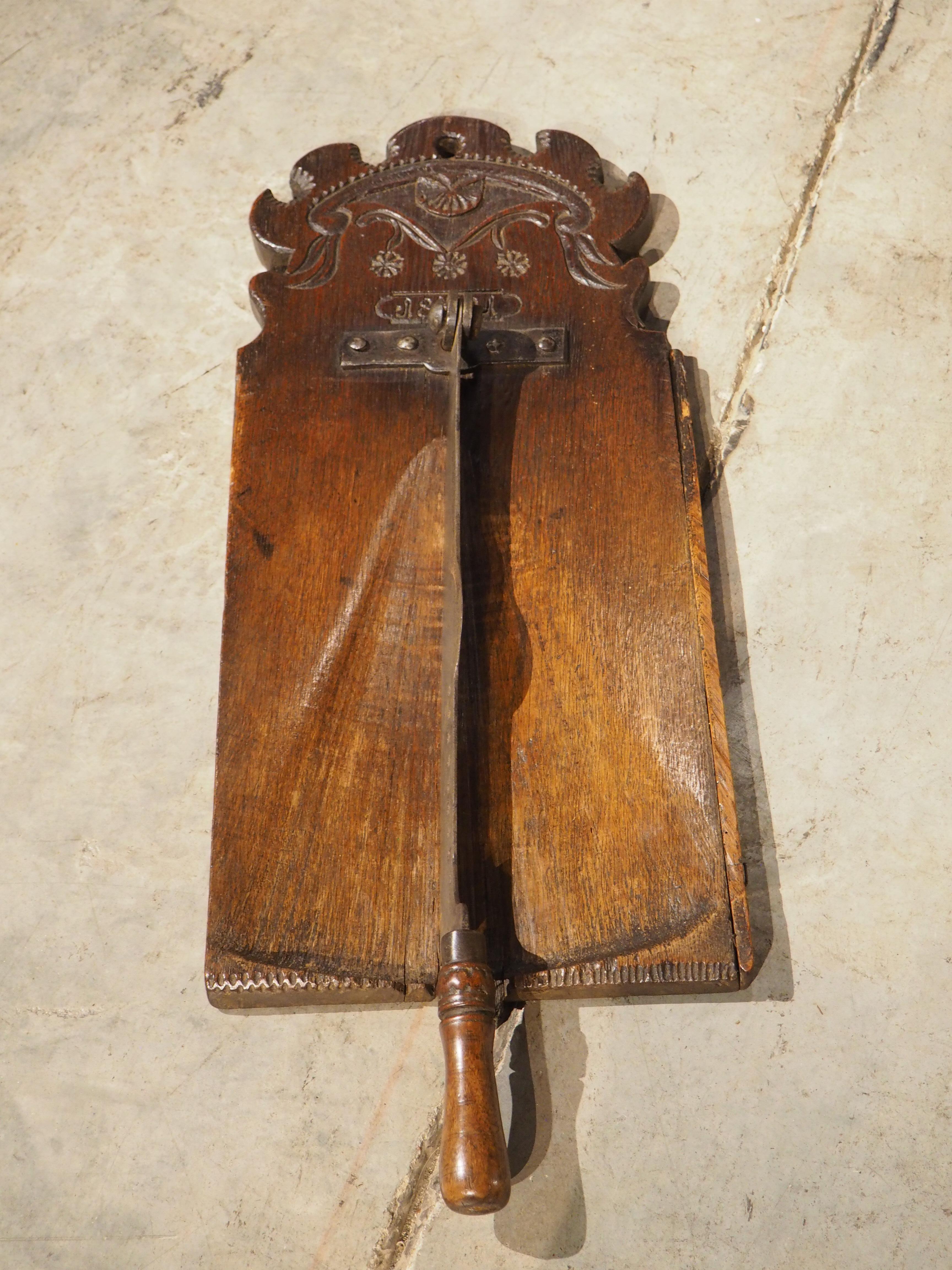 Hand-Carved Antique French Planche à Pain Bread Cutting Board with Iron Blade, Dated 1801