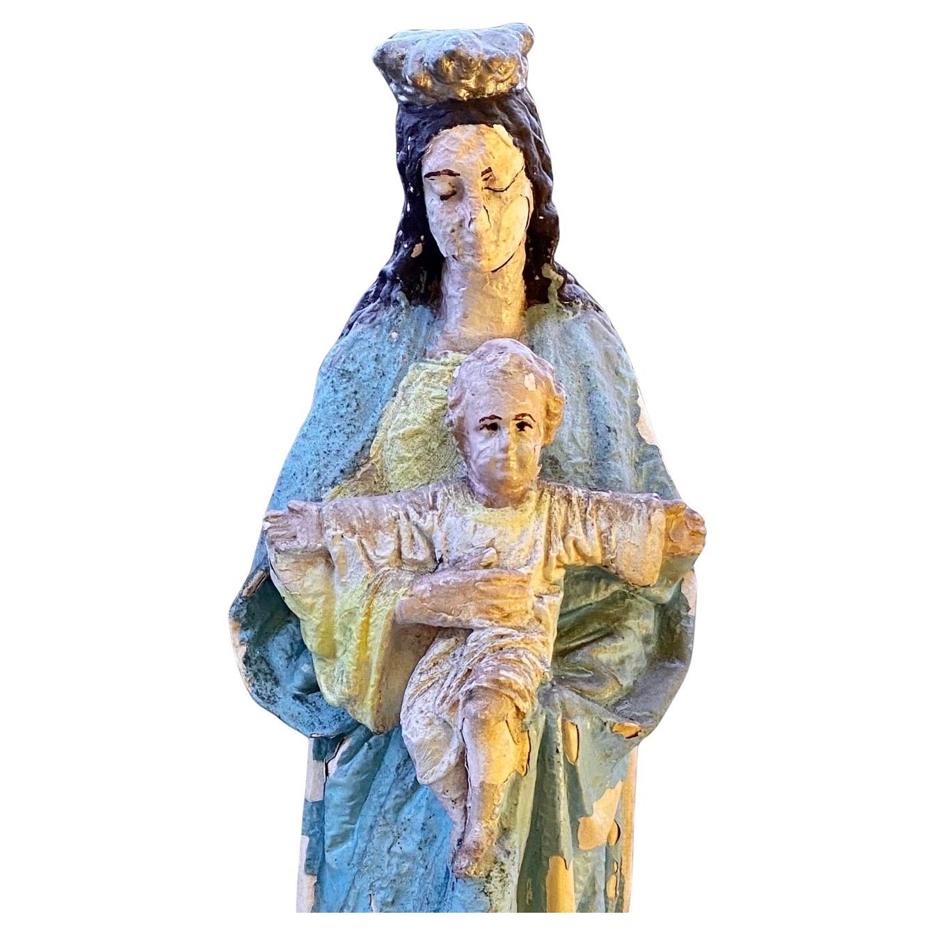 Beautifully aged French plaster Statue of the Virgin Madonna of Notre Dame, with long flowing robe in lovely aged colors, sourced in Paris, France, this statue has beautiful detail and would make a wonderful gift. This statue once likely was housed