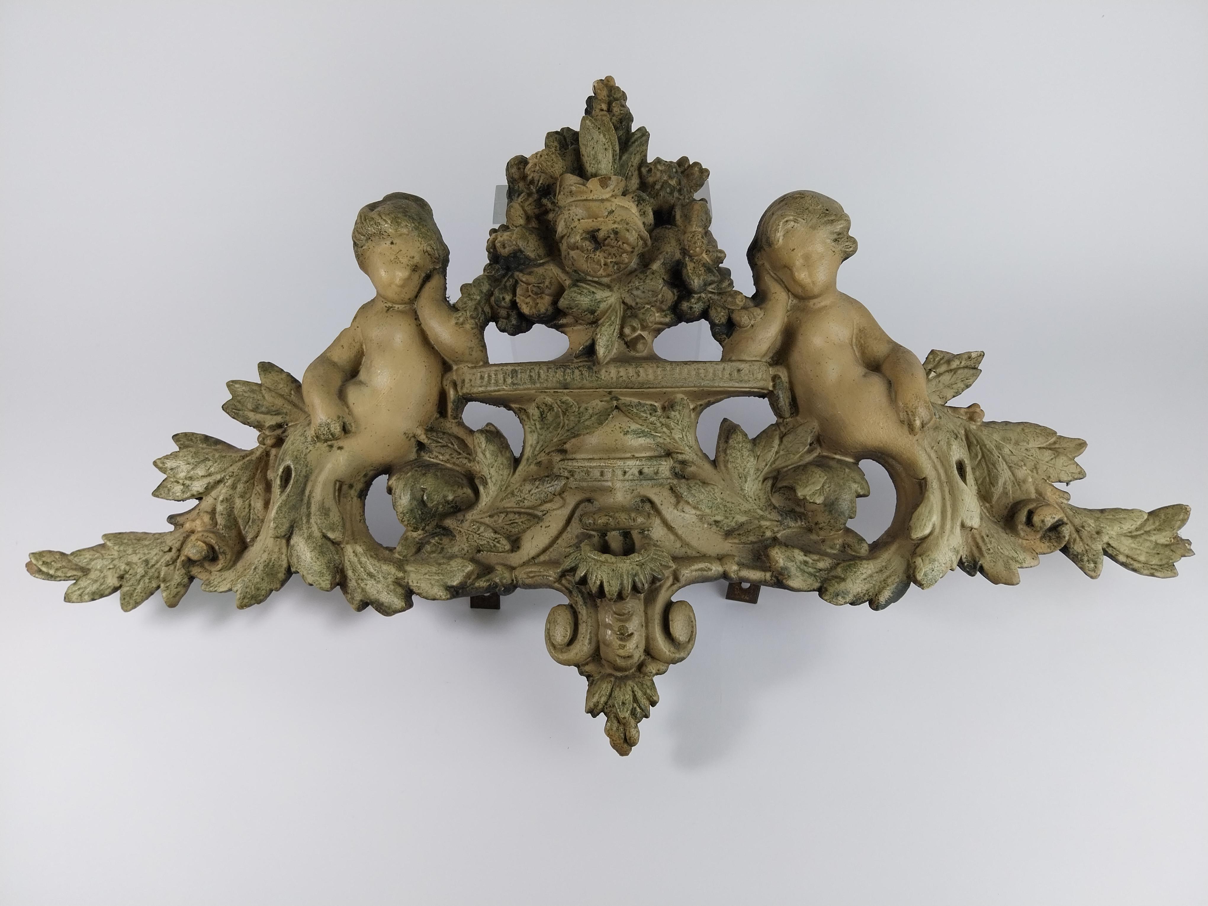 Antique french plaster top ornament.

Representing 2 putti on a branch and a flower basket.

Molded in plaster.

Probably the top of an antique mirror.

Original patina

Fine condition

No restorations

