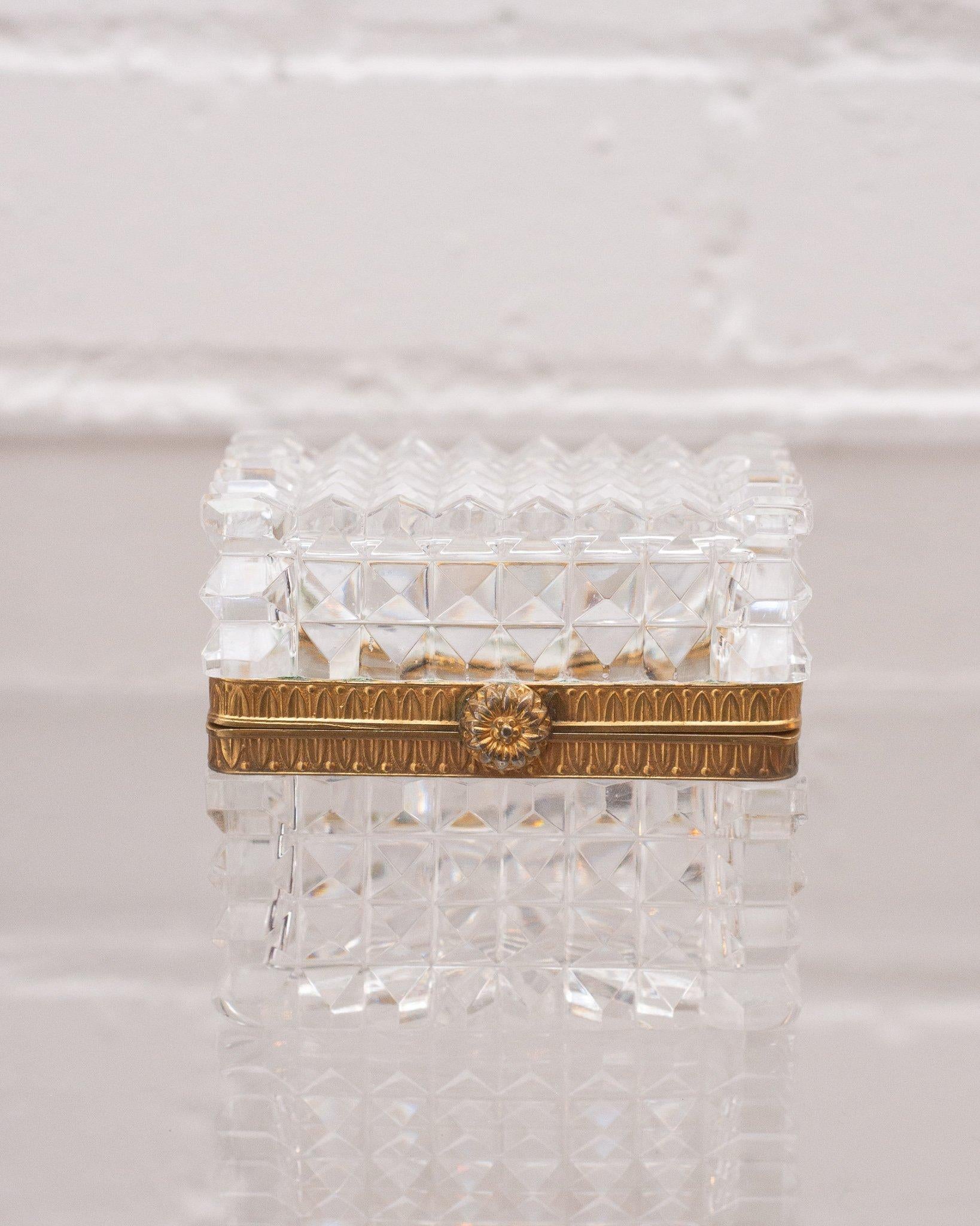This antique pointed cut crystal and bronze box makes a statement in any space. An early 1900s French production, this piece transitions from modern to classic interiors seamlessly with its sophisticated shape and light catching quality.