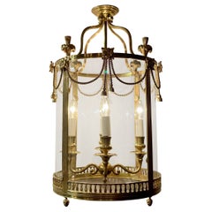 Antique French Polished Brass and Curved Glass Lantern, Circa 1920-1930.