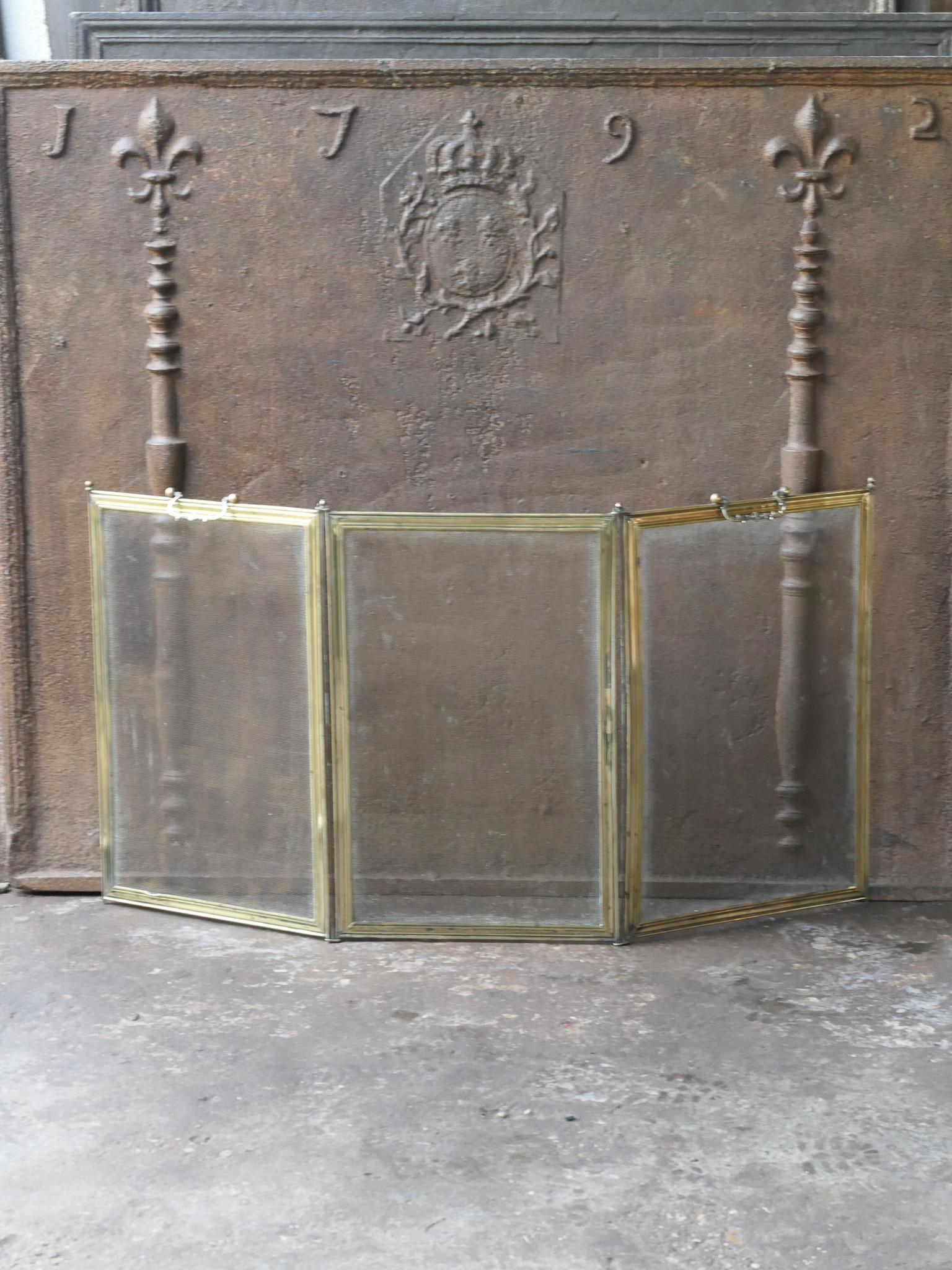 19th century French Napoleon III 3-panel fireplace screen. The screen is made of polished brass and iron mesh. It is in a good condition and is fit for use in front of the fireplace.