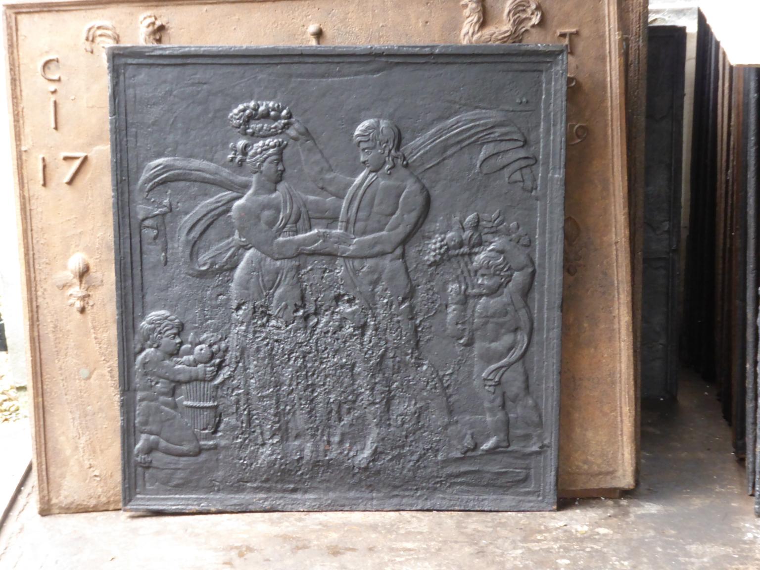 19th century French Napoleon III fireback with Pomona, goddess of fruitful abundance. The fireback is made of cast iron. It has a black / pewter patina. The condition is good, no cracks.

This product weighs more than 65 kg / 143 lbs. All our