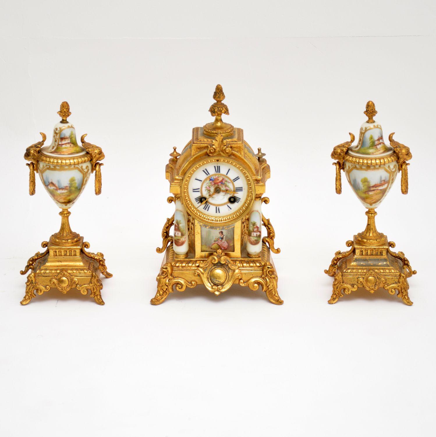 Very pretty antique French clock set, consisting of the clock and two garnitures, all dating from circa 1890-1910 period. This whole set is in good original condition and the gilding is a bit rubbed in places, which adds to the character. The