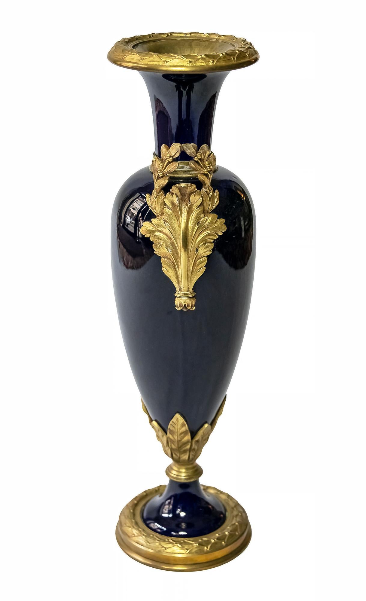 Antique French glazed cobalt blue decorative vase with gilded bronze handles and decorative details.