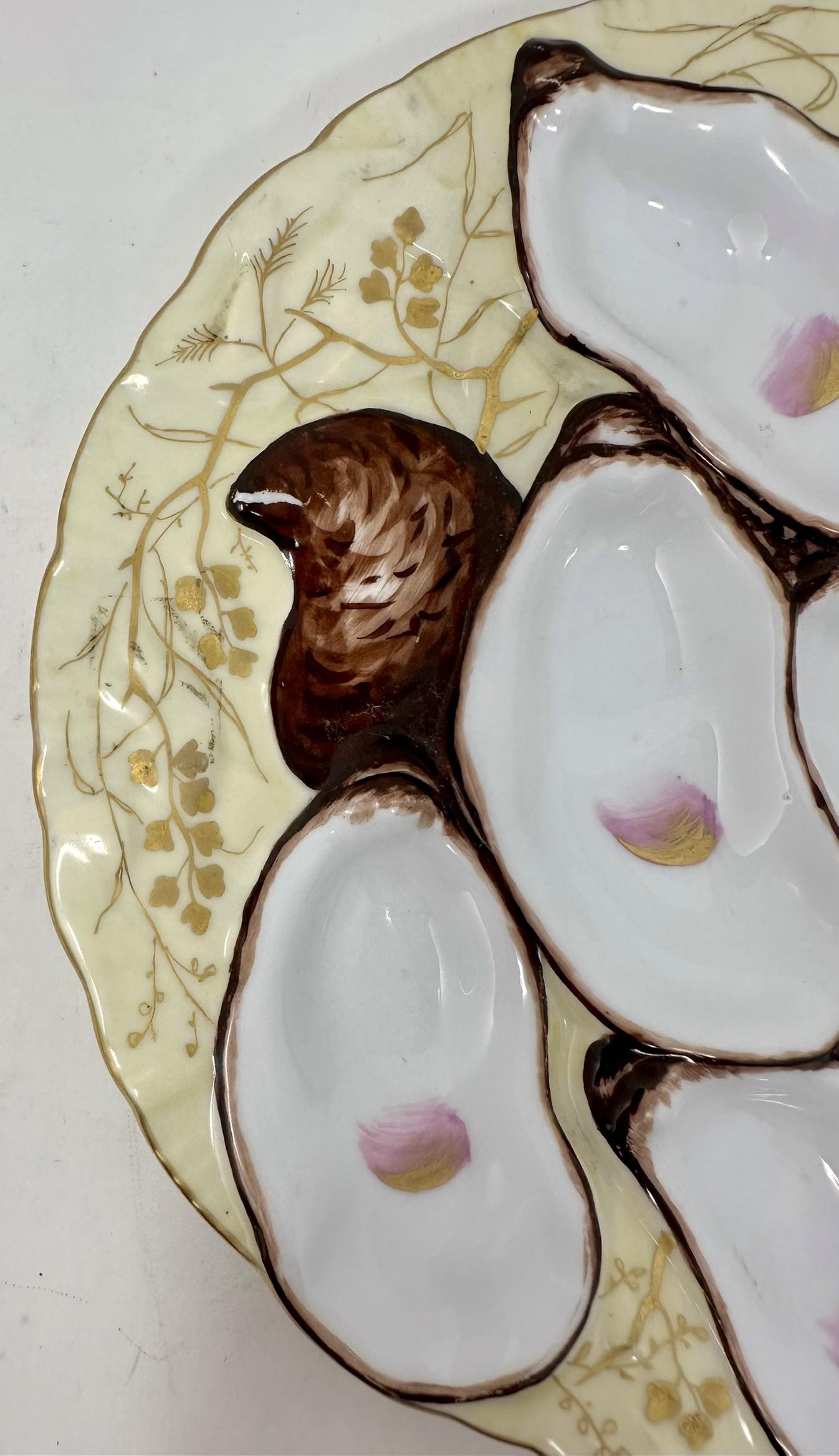 Antique French Porcelain Soft Yellow and Gold Hand-Painted Turkey Pattern Oyster Plate, CIRCA 1880.