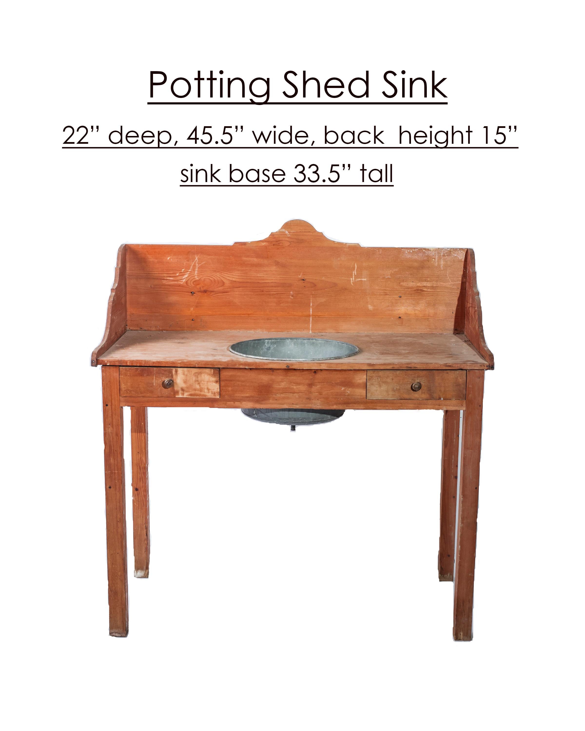 Purchased in Lyon, France, this dry sink was originally used in a potting shed. It's graceful carved wooden back splash elevates the visual appeal of the piece. The dry sink finish has a beautiful patina earned by more than 100 years of service.