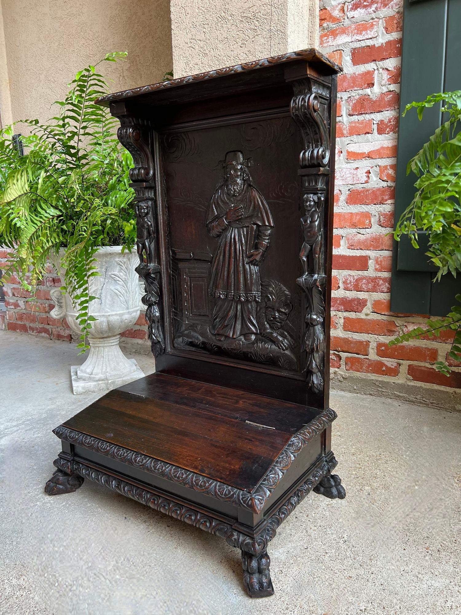 Antique French Prayer Kneeler St. Jerome Lion Catholic Chapel Carved Oak c1880.

Direct from France, one of two highly carved antique prayer kneelers (or “prie dieu”) from our most recent container.
The stunning panel back here features a hand