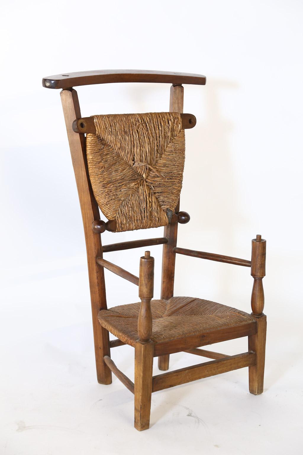 This charming prie dieu was once used in a French church as both chair and kneeler. The 18.5 inch high rush seat raises to reveal a 9 inch high rush kneeler. This piece will surely add provincial charm to your home.