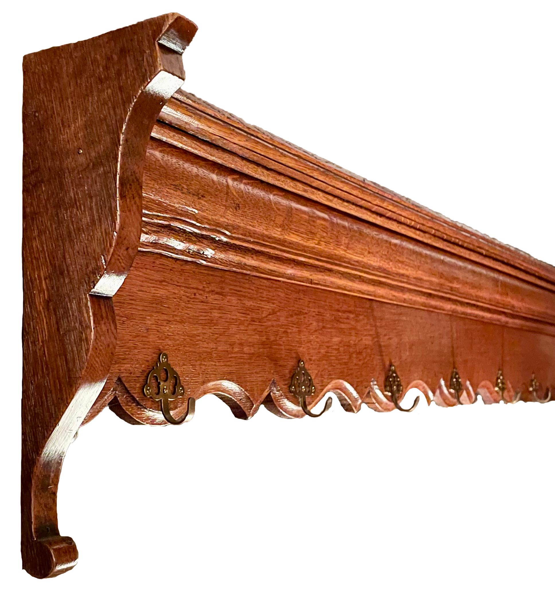 Antique French provincial carved fruitwood hanging rack, circa 1890-1900.