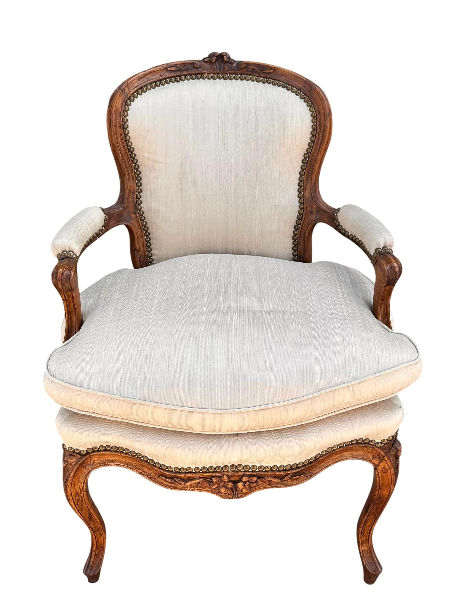 Antique 18th C French Provincial Carved Mahogany Fauteuil Arm Chair

Additional information: 
Materials: Cotton, Mahogany, Silk
Please note that this item contains materials that are legally subject to a special export process that may extend the