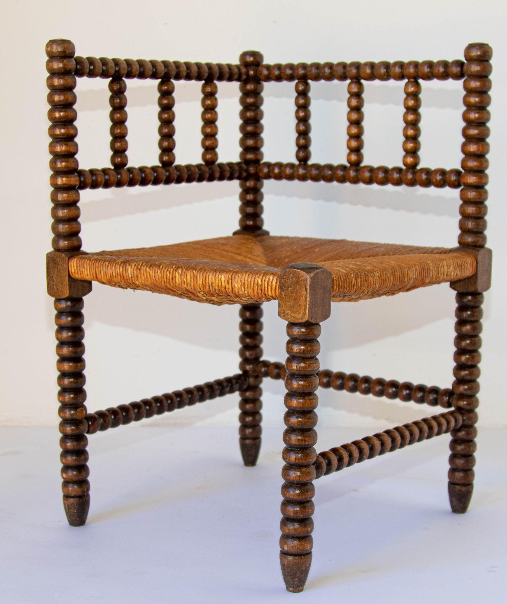 Antique 19th c. French Bobbin Rush Corner Chair.
French rush-seat corner chair, Coin du Feu. 19th Century French Provincial-style carved oak armchair with open backs and rush seat.
Antique sturdy useable chair, wood stick and ball craftsmanship