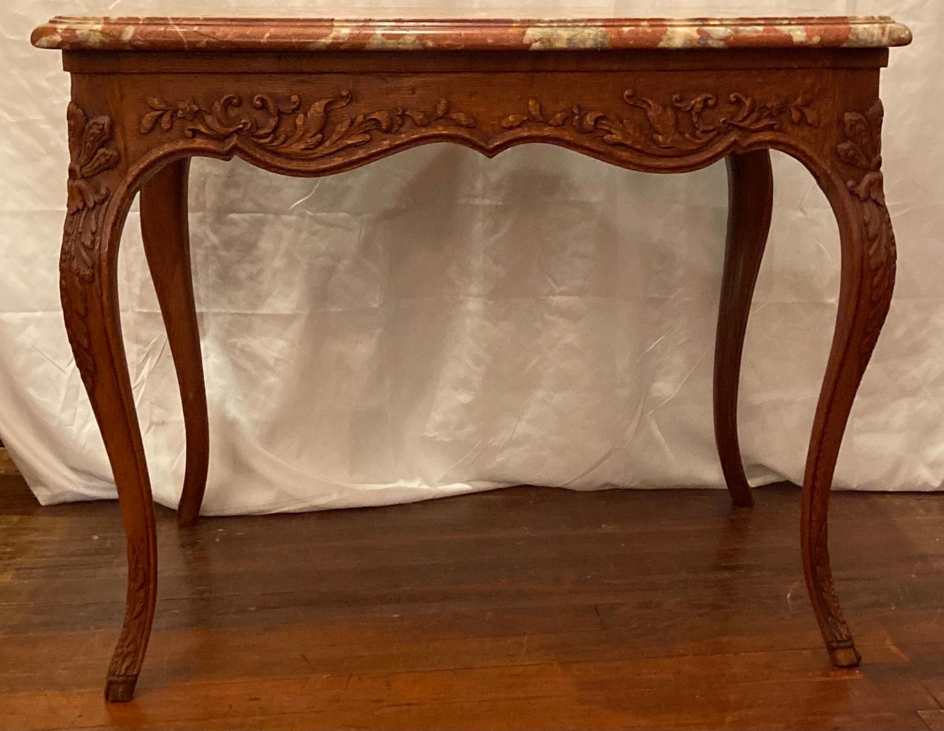 Antique French Provincial carved oak marble top table, Circa 1860.
This table would fit well in almost any room where you place it. Very pleasing and graceful.