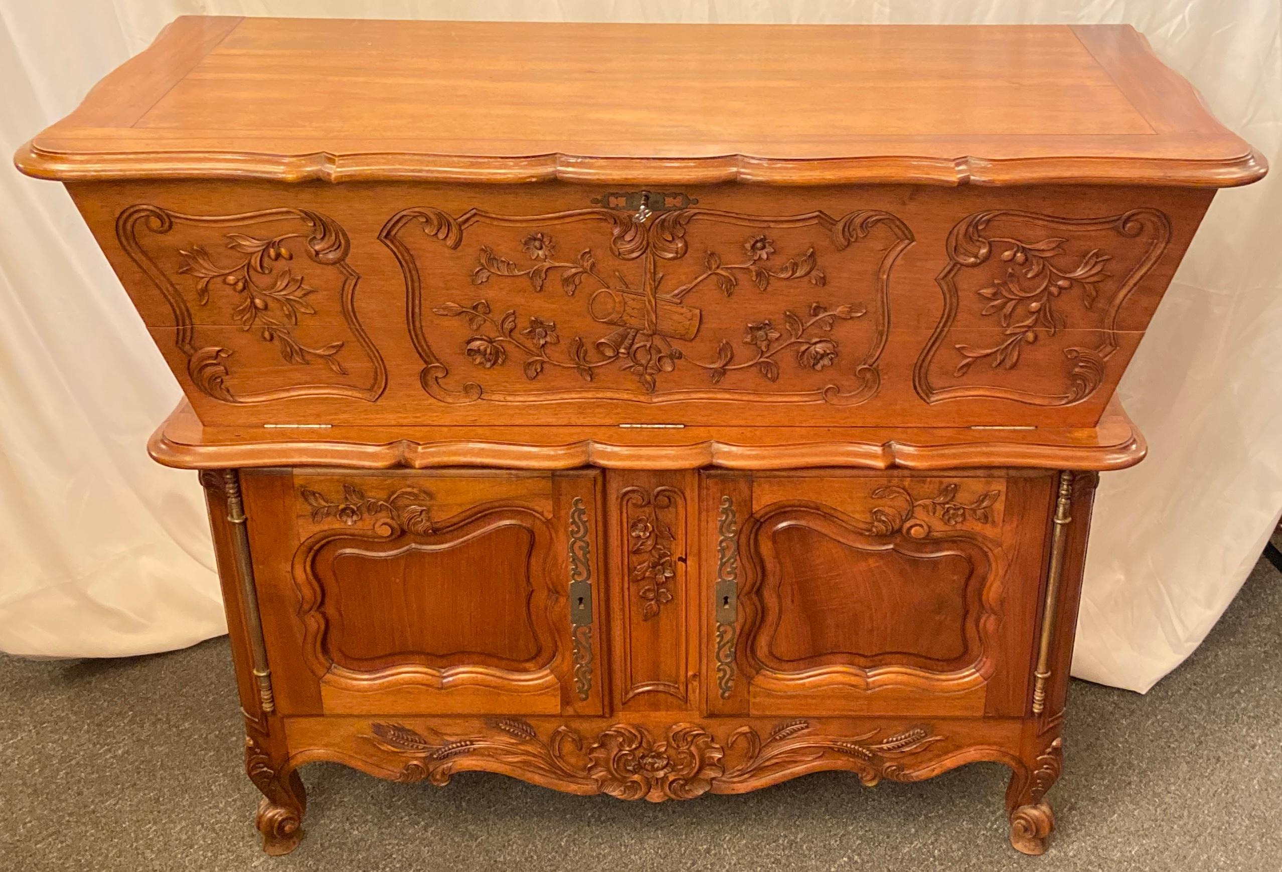 Antique French Provincial carved walnut petrin dough bin table, circa 1900.
A versatile piece, this 