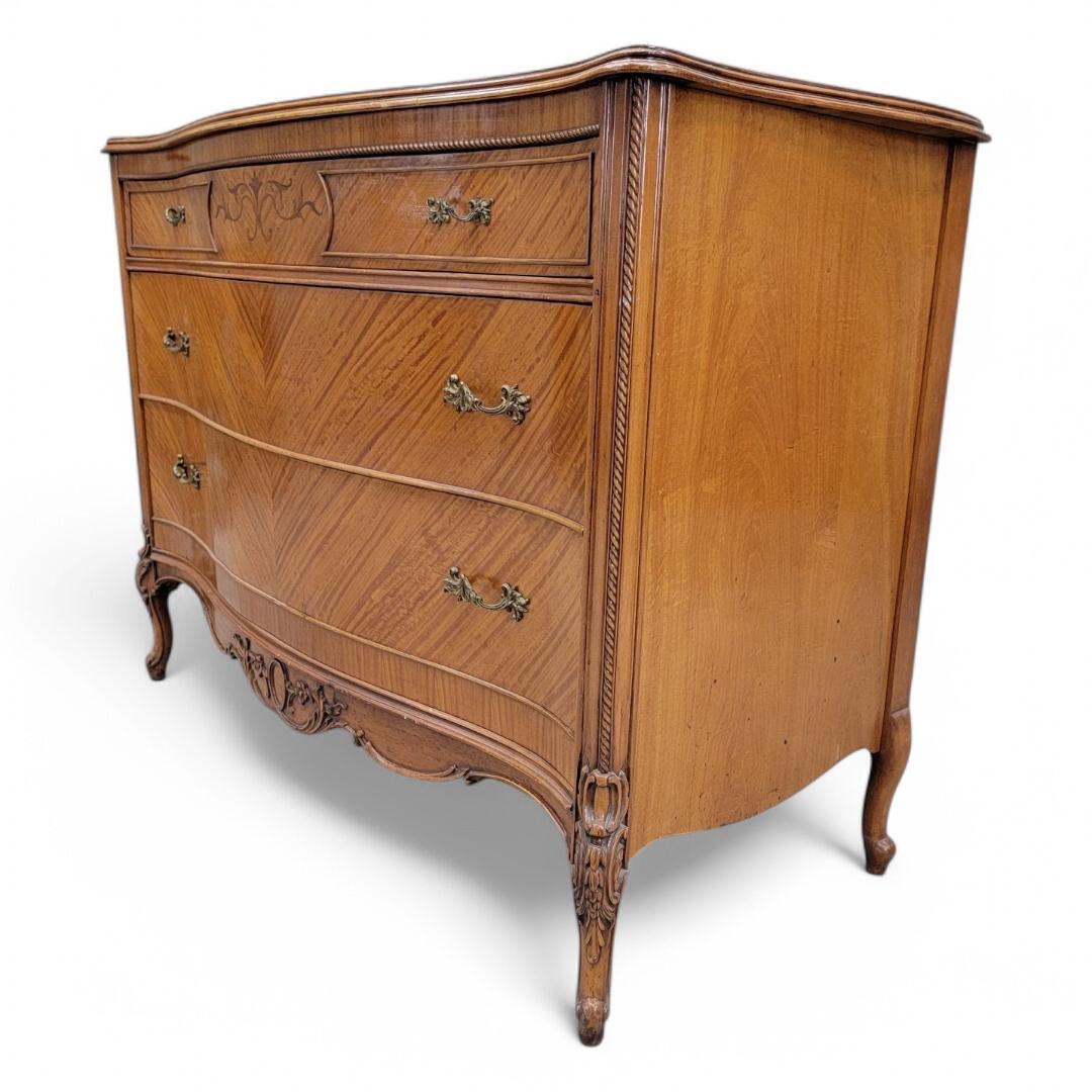 Antique French Provincial French Mahogany Inlaid Marquetry Chest of Drawers

This beautiful antique French Provincial chest of drawers showcases intricate inlaid marquetry, reflecting the timeless elegance of French craftsmanship. With three