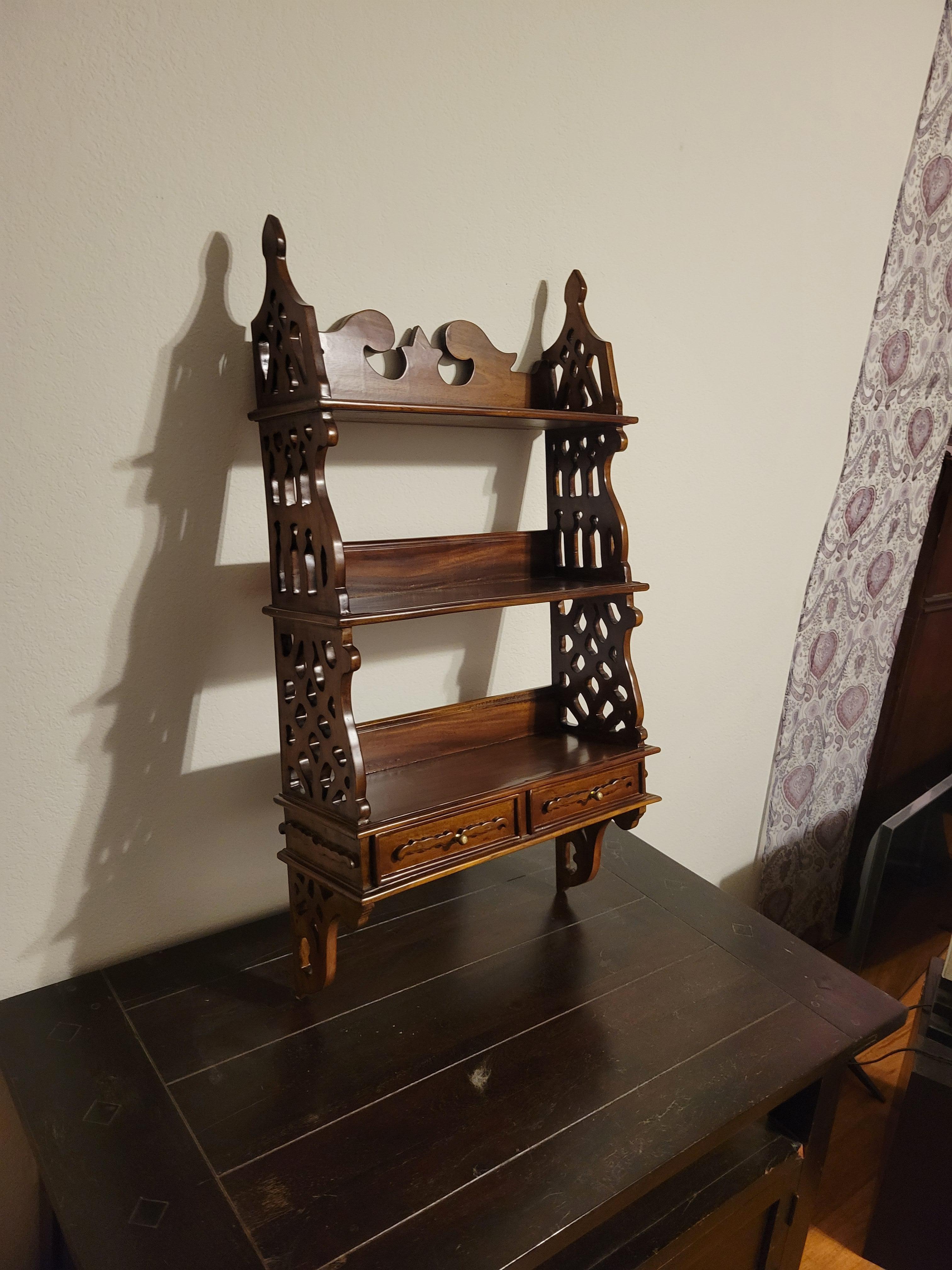 Antique kitchen shelf, with hand-caved sides. It has 3 tiers and 2 drawers at the bottom. Made out of solid likely African Mahogany. The shelf is 35