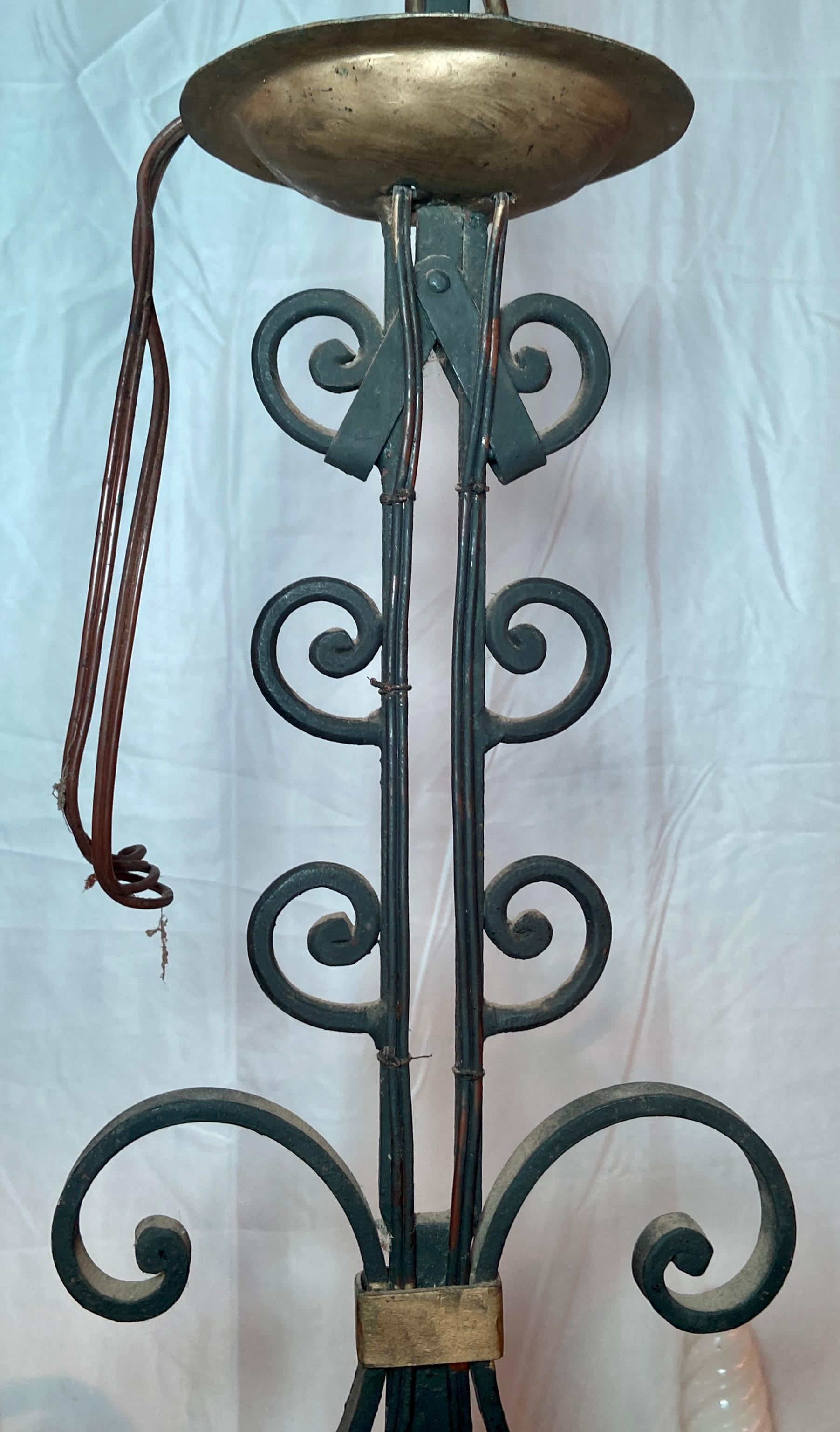 Antique French provincial iron chandelier with copper poacher.