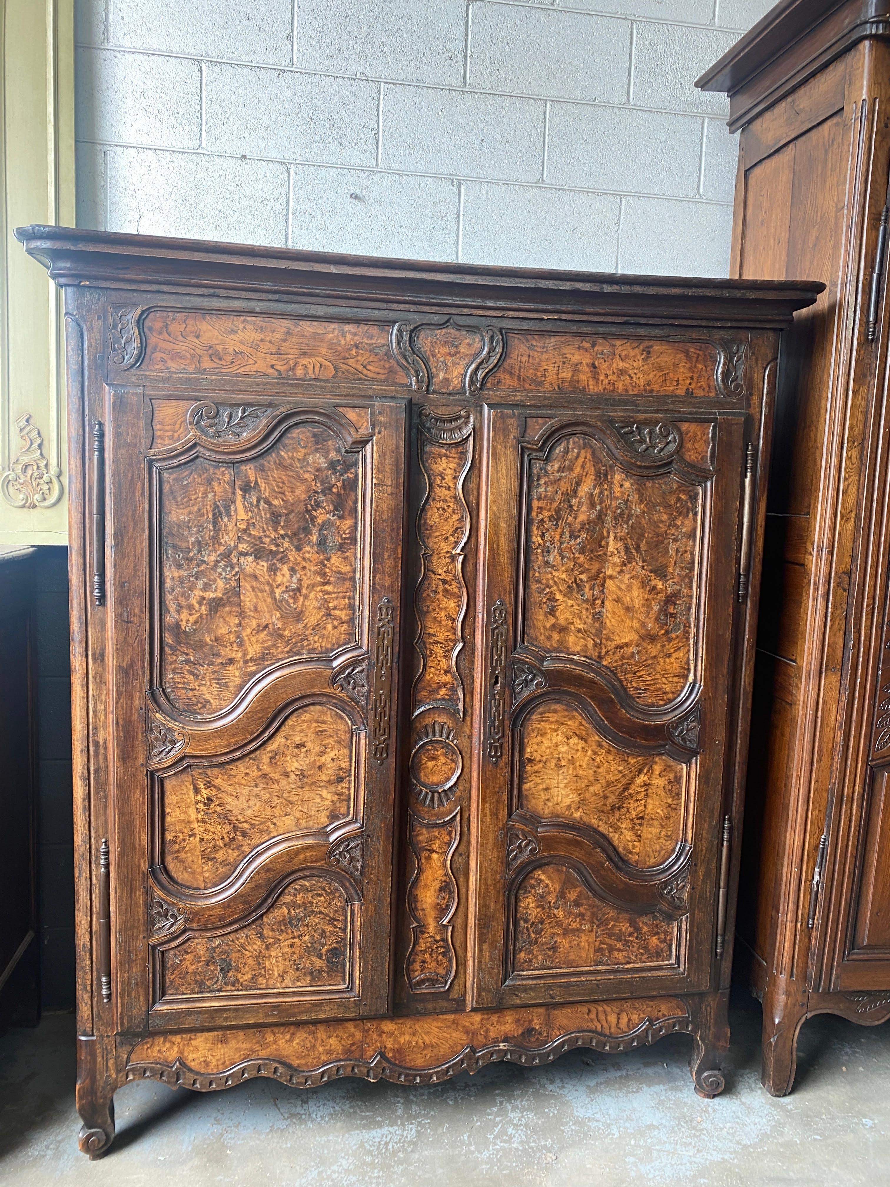 Beautiful antique armoire French Provincial Louis XV burled walnut and walnut with three adjustable interior shelves, late 1700's, 18th Century. This 18th c. This French burled walnut armoire is rare find because of the size and the burled walnut.