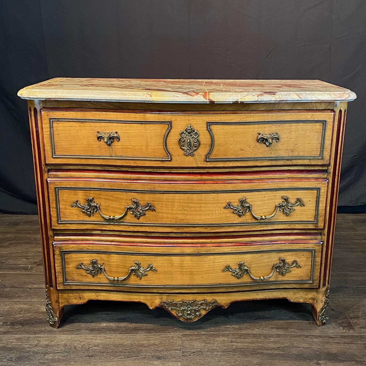 Antique French Louis XV rose top marble commode or chest of drawers with exquisite top!   Elegant cherry wood base with three shaped front drawers supporting a slightly bowed front marble top resting on lovely reeded sides all over decorated legs