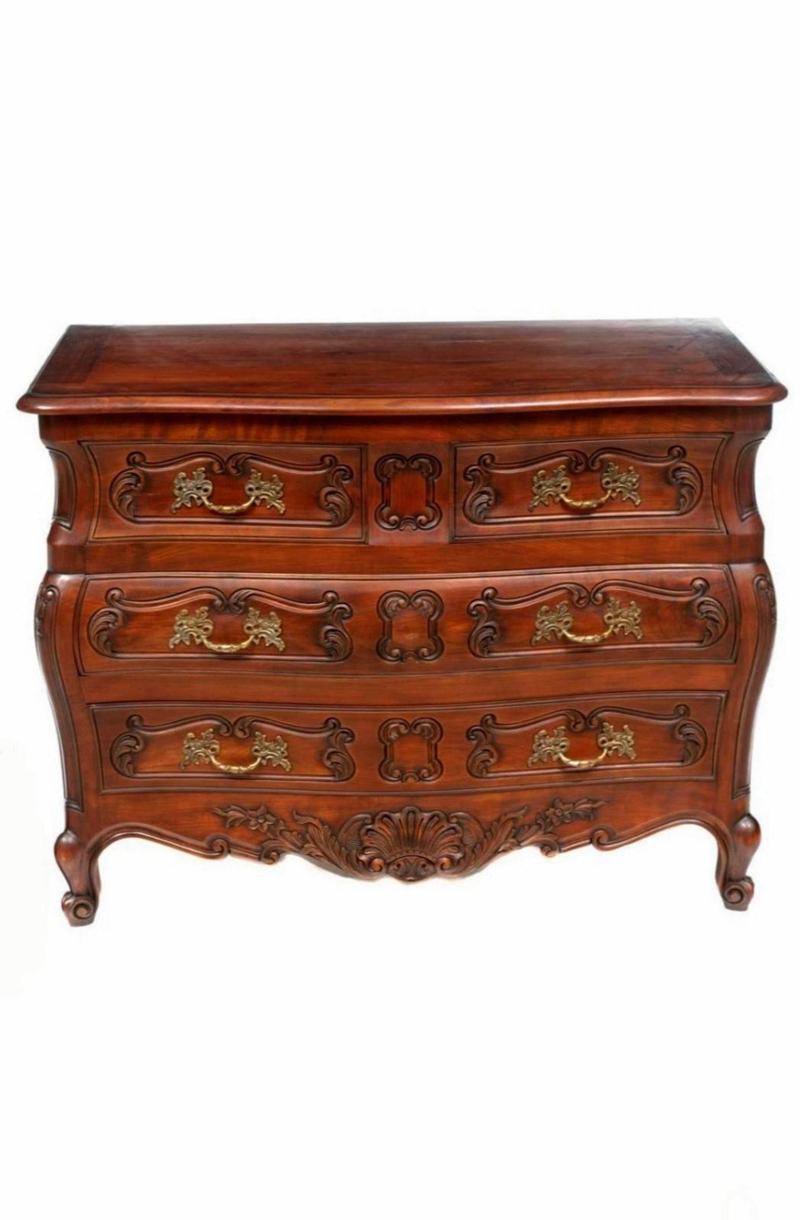 An elegantly sophisticated French Provincial Louis XV style bombe chest of drawers commode. 

Exquisitely hand-crafted in France in the late 19th century, featuring a handsome dark rich finish, well formed and gracefully curvacious silhouette,