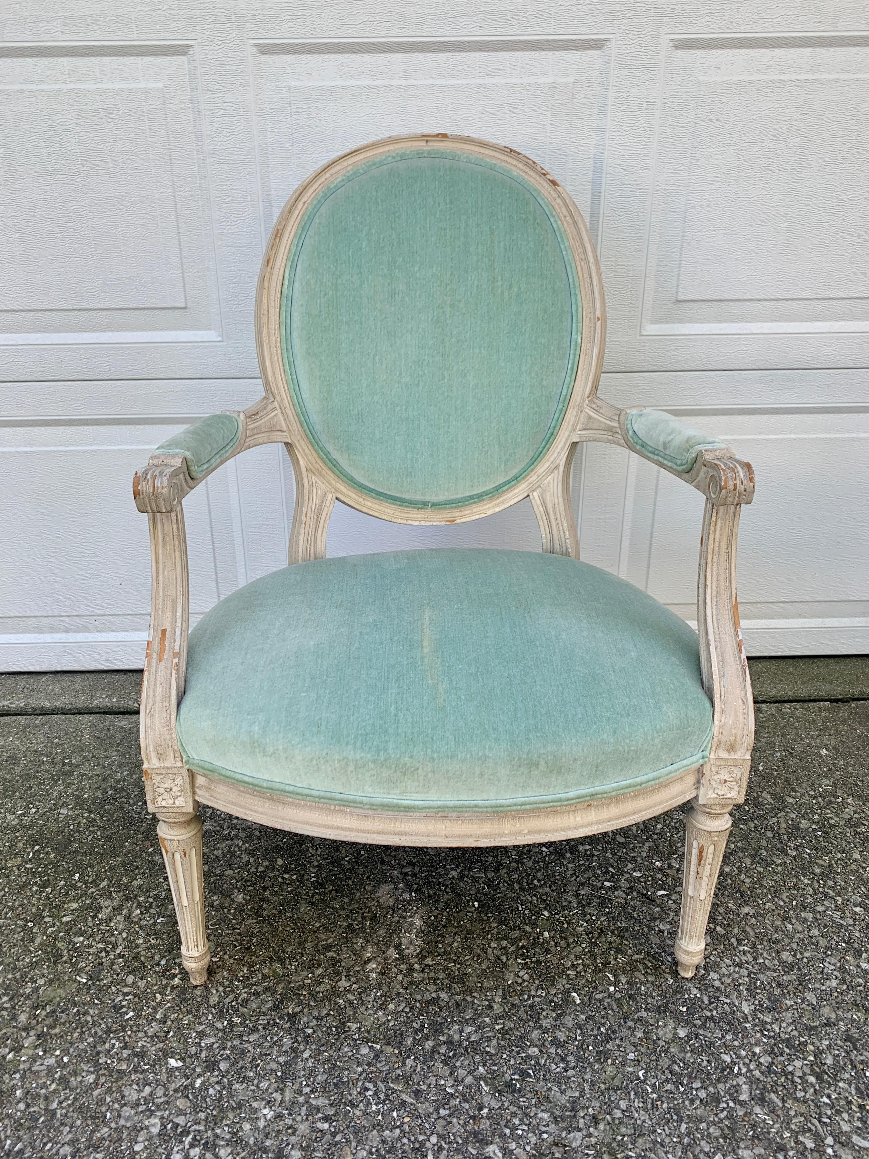 A stunning French Provincial Louis XVI style armchair

France, Circa 1920s

Carved painted wood frame, with light blue velvet upholstery

Measures: 24.5