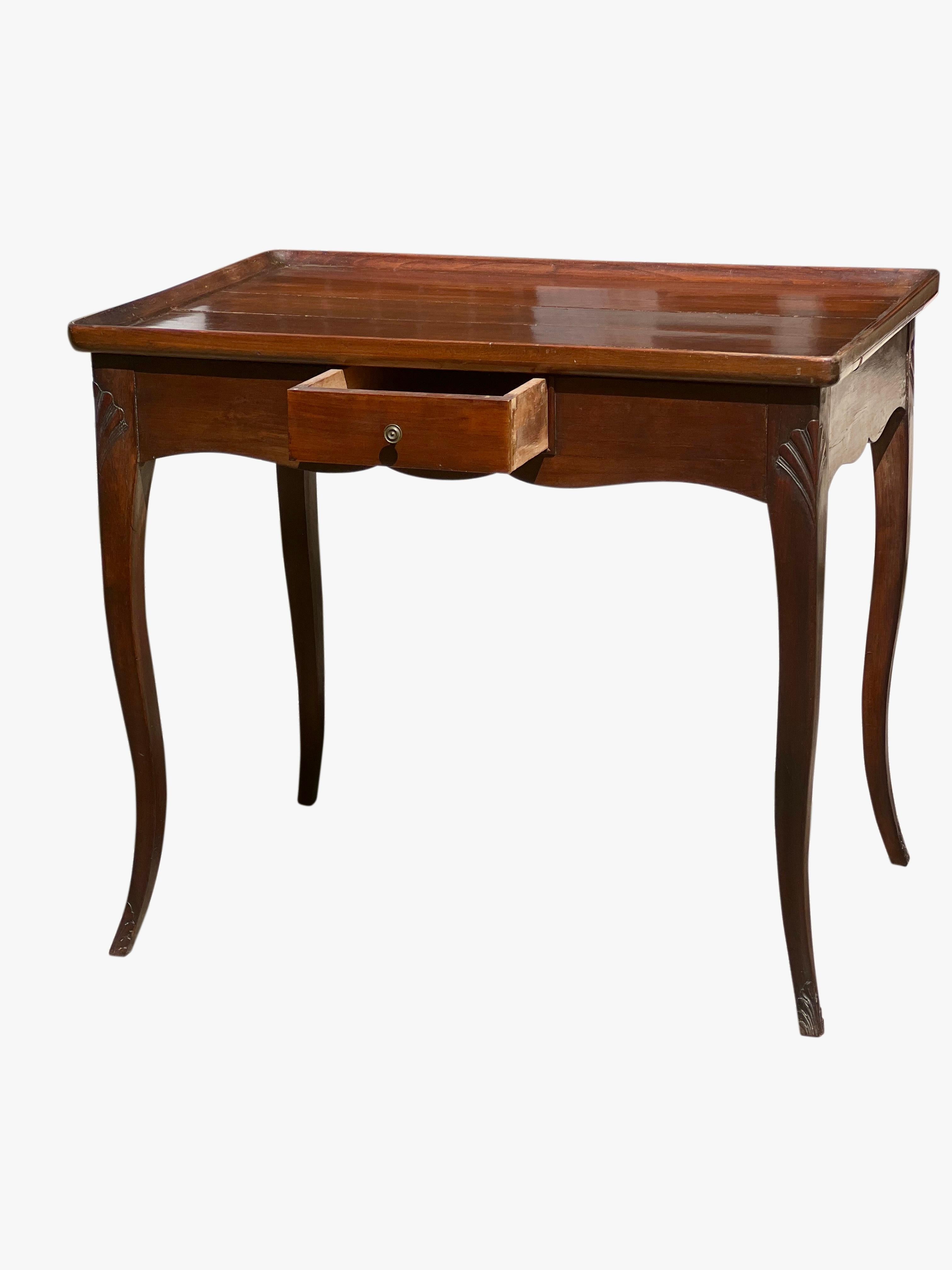 Antique French Provincial mahogany Louis XV style side or  tea table, circa 1900.

This lovely table has been meticulously cared for and has beautiful patina with a gorgeous, satin-like sheen. The slender cabriole legs have a gentle taper with