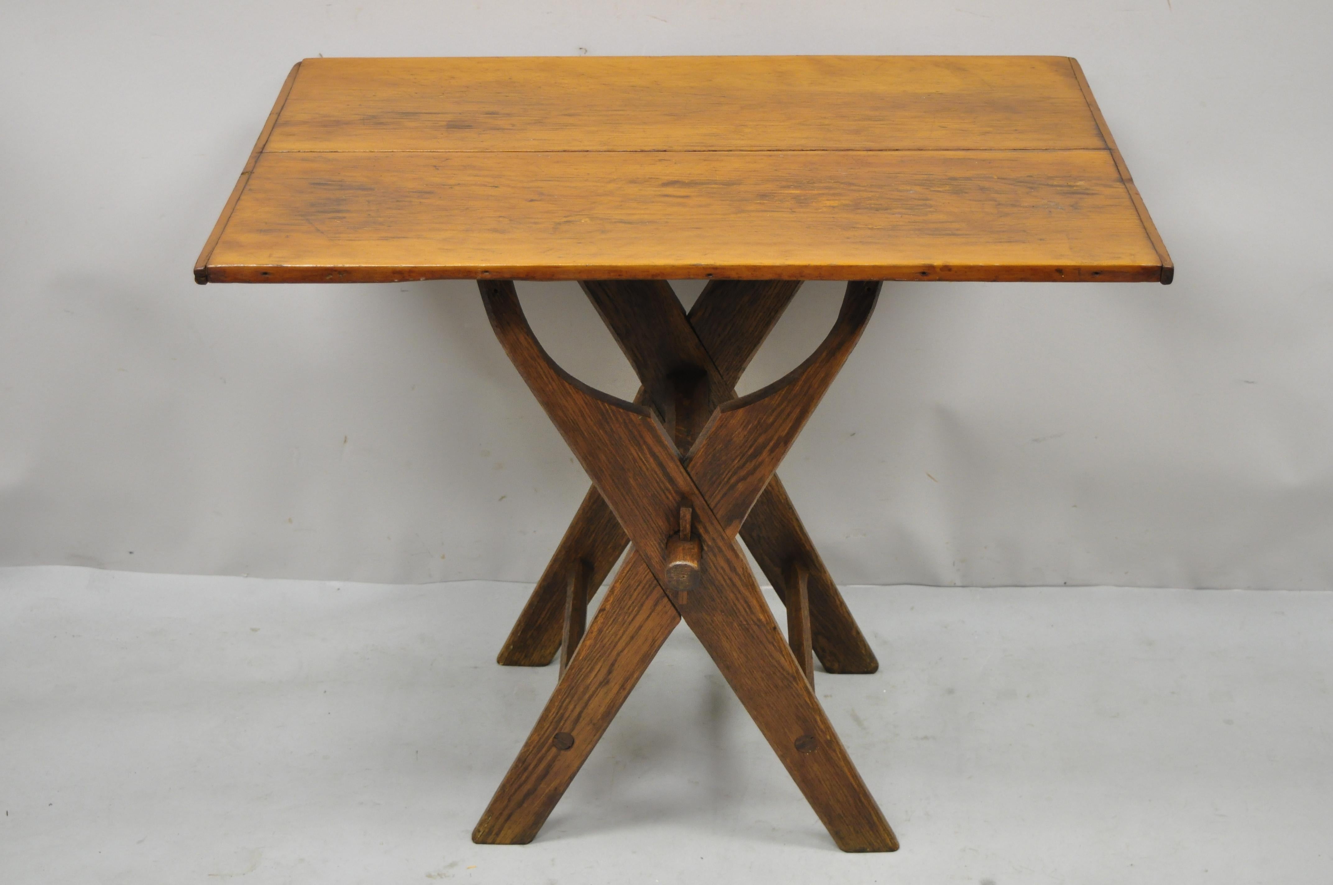 Antique French orovincial cherry & oak wood x-frame scissor work table. Item features cross stretcher x-frame base with exposed joinery, solid wood construction, beautiful wood grain, tapered legs, very nice antique item, quality French
