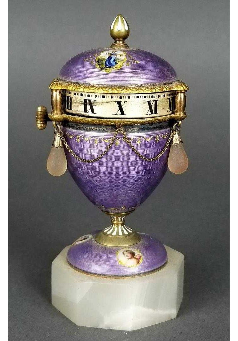 Antique French purple Guilloche enamel rotary clock,
circa 1900.

Measures: 4.5