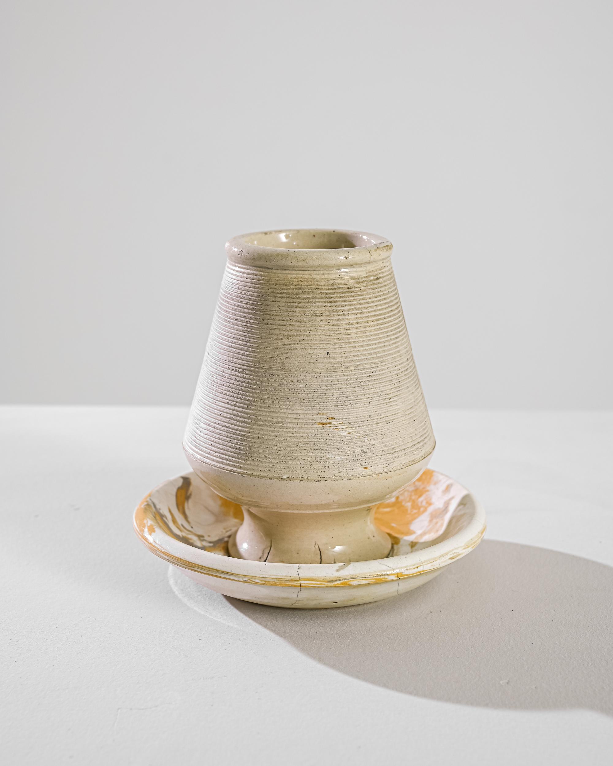 An intriguing vintage ceramic object. This earthy stoneware pyrogene was hand-thrown on the wheel, the combed ridges offer a convenient match strike surface. Once found in Parisian cafes, these quaint vessels serve as contemporary accents.