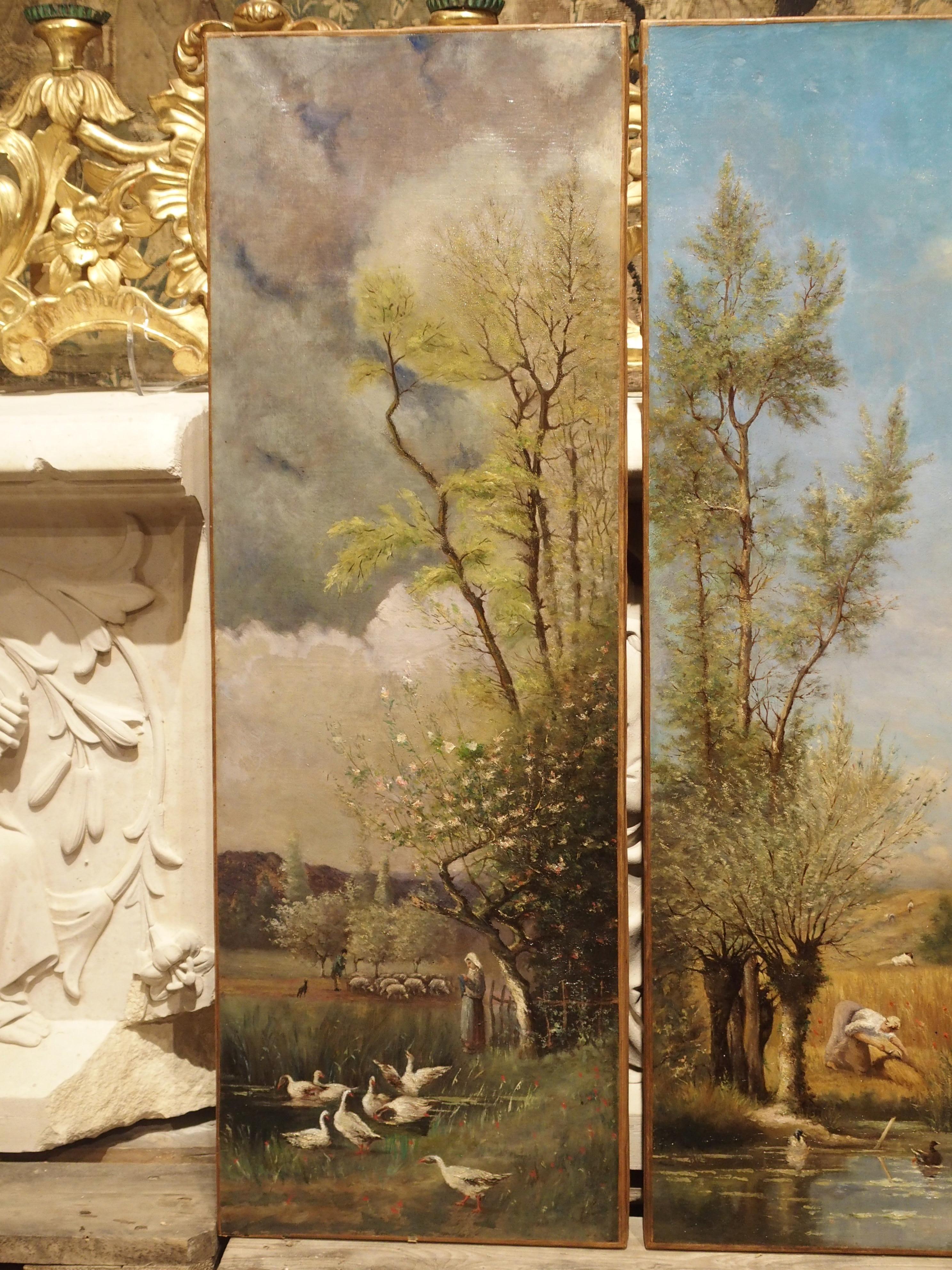 This bright antique quadriptych of the Four Seasons depicts pastoral French landscapes of people and animals in settings of Spring, Summer, Fall, and Winter. Each painting is the same size and features a large tree in its various stages of foliage