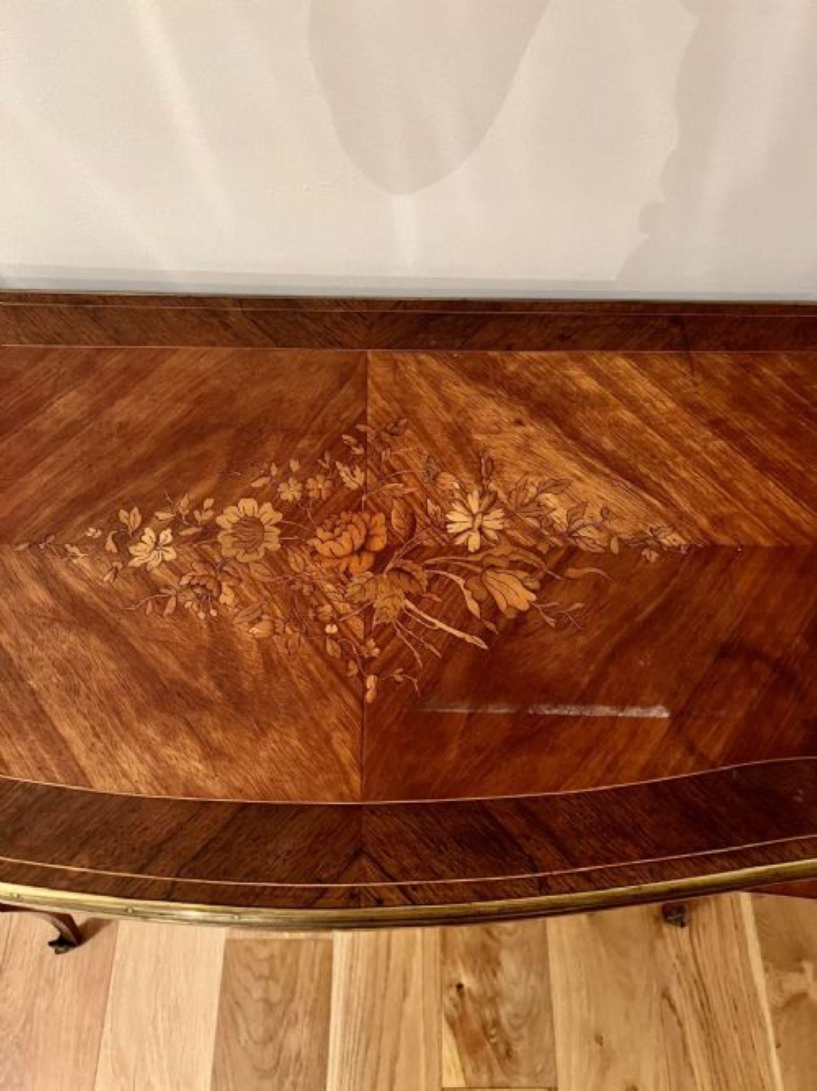 Antique French quality kingwood marquetry inlaid ormolu mounted card table having a quality kingwood marquetry inlaid serpentine shaped swizzle top with a brass edge opening to reveal a green baize interior above a marquetry inlaid frieze standing