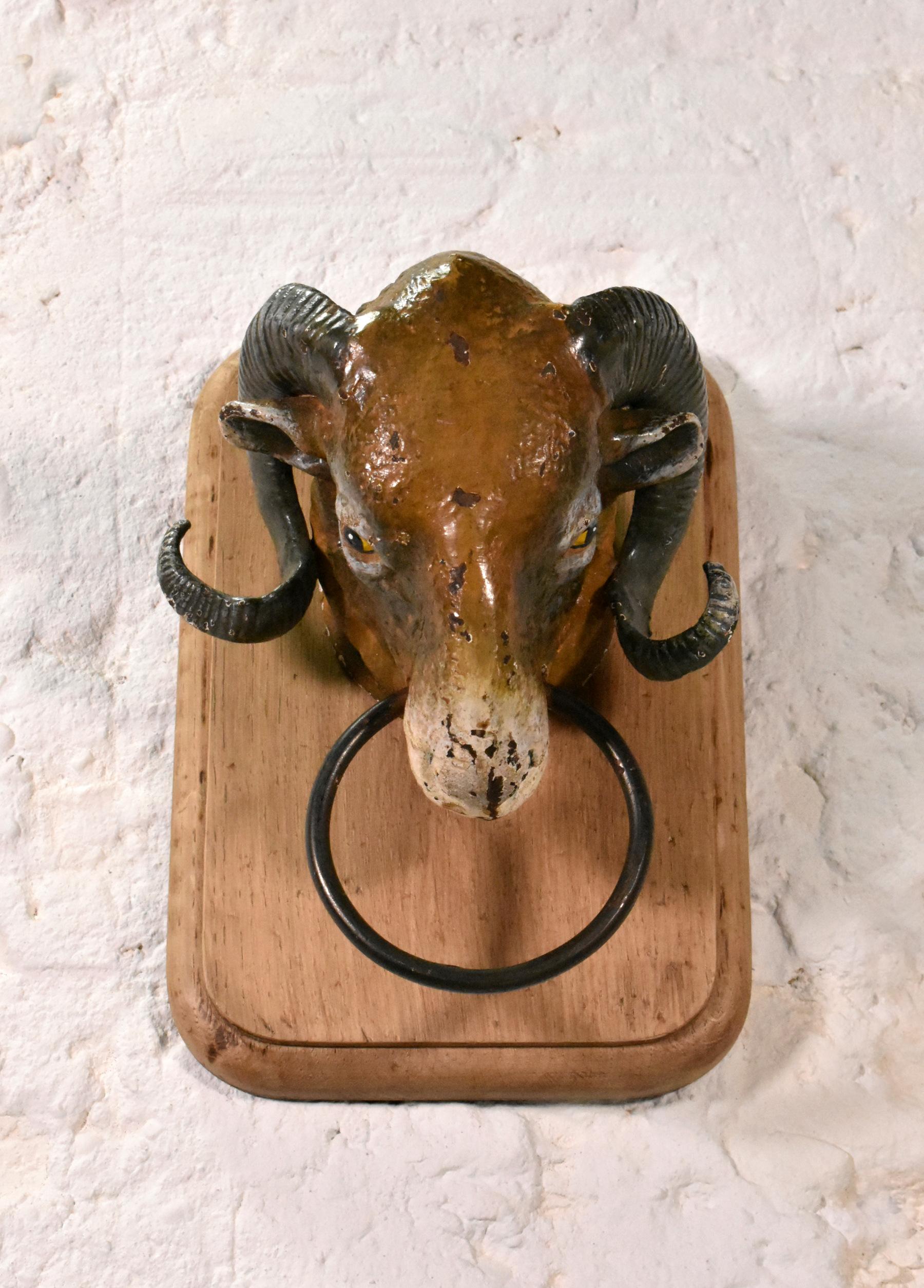 Antique French Cast Iron Ram's Head from Butcher's Shop 

An original cast iron ram's head that would have adorned a boucherie / butcher's shop interior. 

A well-proportioned solid piece in quality casting with its original polychrome paintwork.