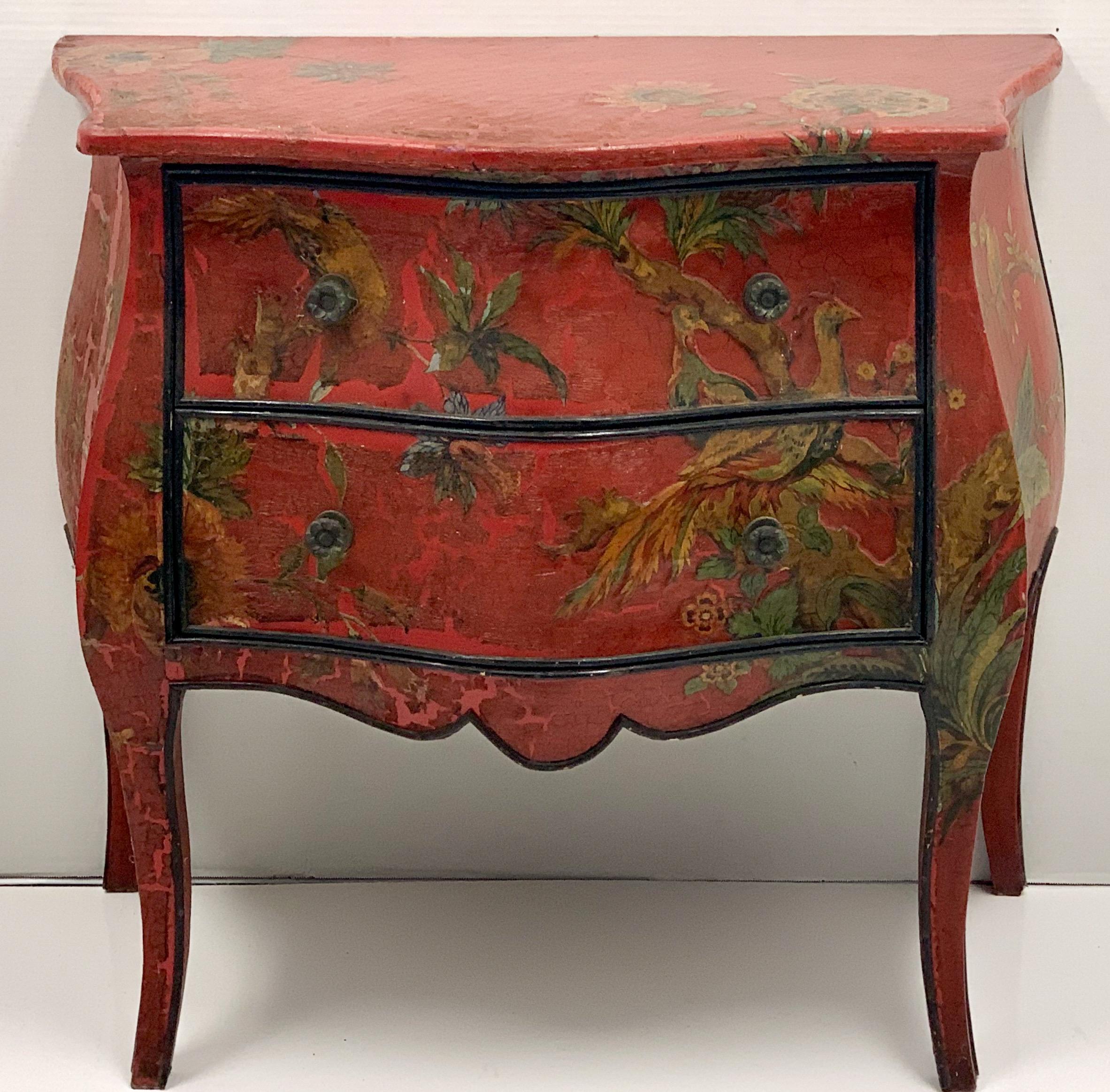 This is an antique French red chinoiserie bombe chest with early decoupage applied throughout the body. The piece has Louis XVI styling, and does show some age appropriate wear.