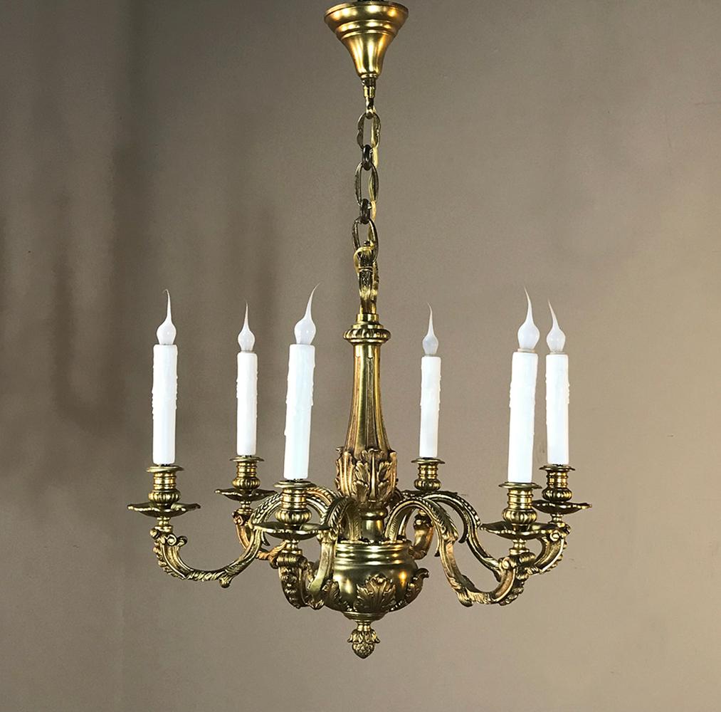 Antique French Regence bronze chandelier is a delight to the eyes, with hand-cast bronze formed in a timeless architectural shape that will truly transcend time! It was newly re-wired for the USA with six arms, candelabra sockets and comes with