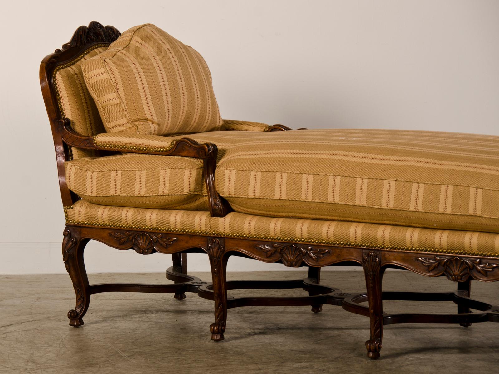 A rare Régence period (1715-1723) walnut chaise longue from France circa 1720. The chaise longue revolutionized life among the upper classes in early eighteenth century France with its sensuous shape and level of comfort that had not been seen