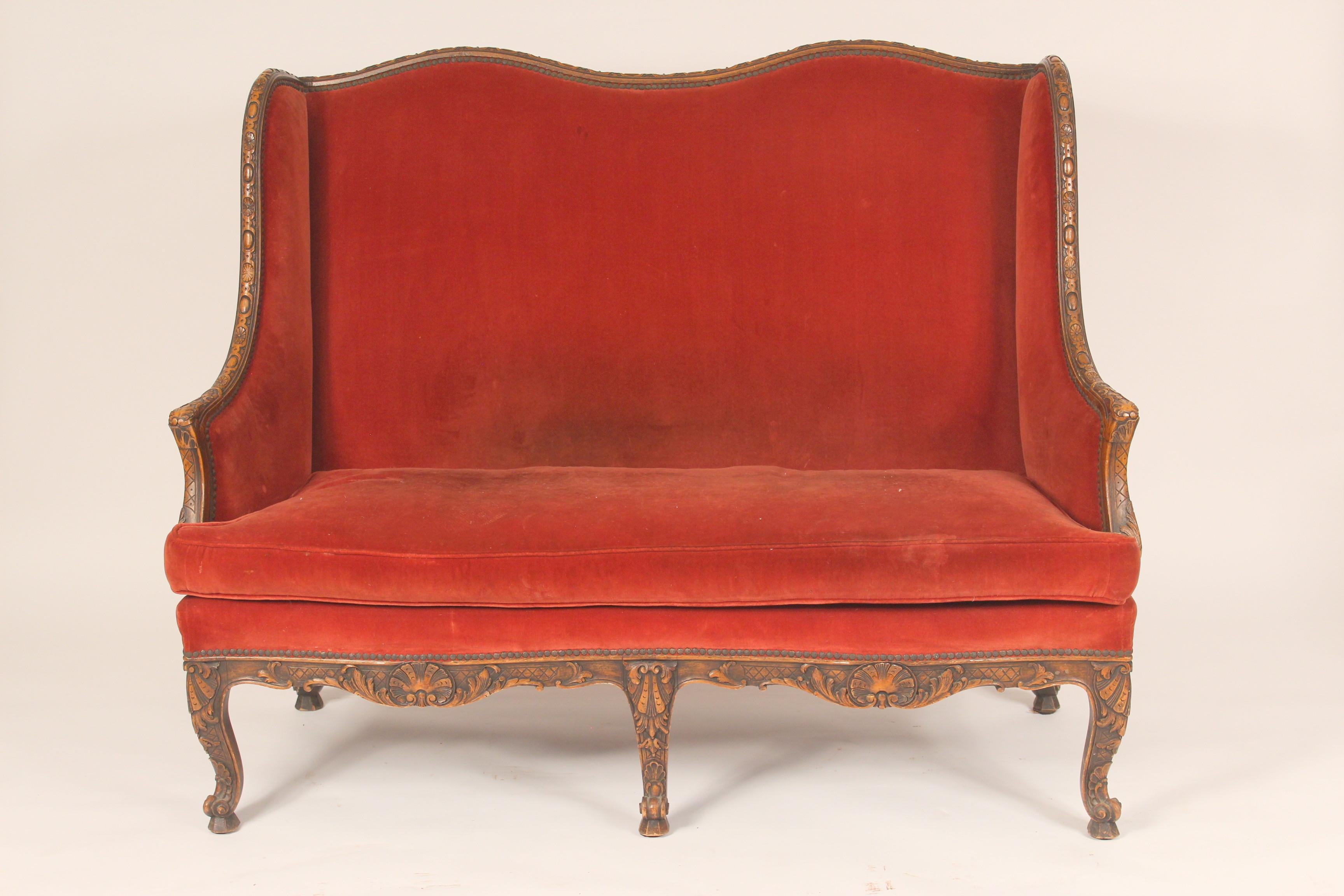 Antique French regence style carved beech wood settee, late 19th century.