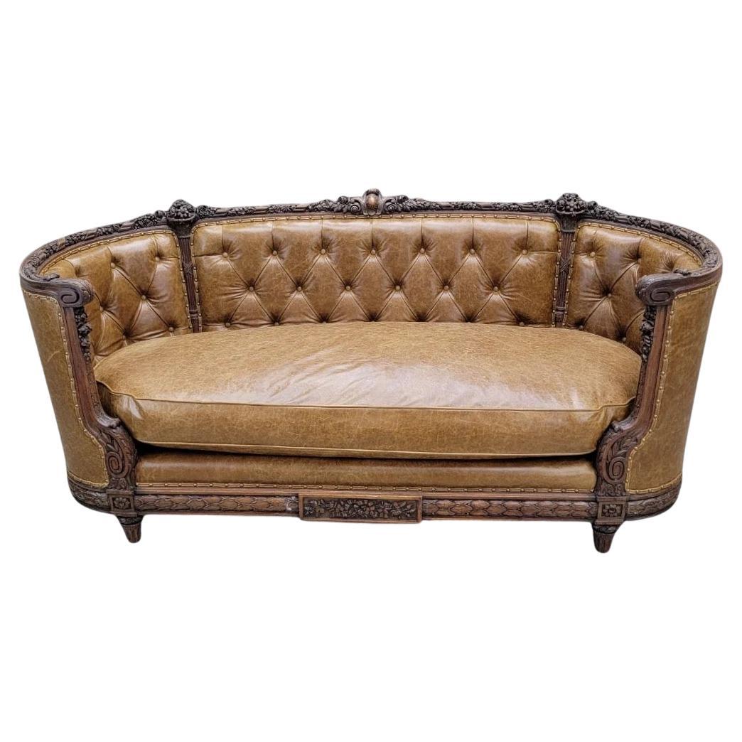 Antique French Regency Mahogany Carved And Curved Sofa Reupholstered In Leather