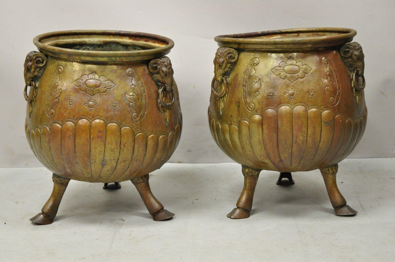 Antique French Regency Neoclassical Rams Head Copper Planter Pot - a Pair. Item features tripod hoof feet, rams heads with drop ring pulls, engraved bodies, very nice antique pair. Circa 19th Century. Measurements: 14.5